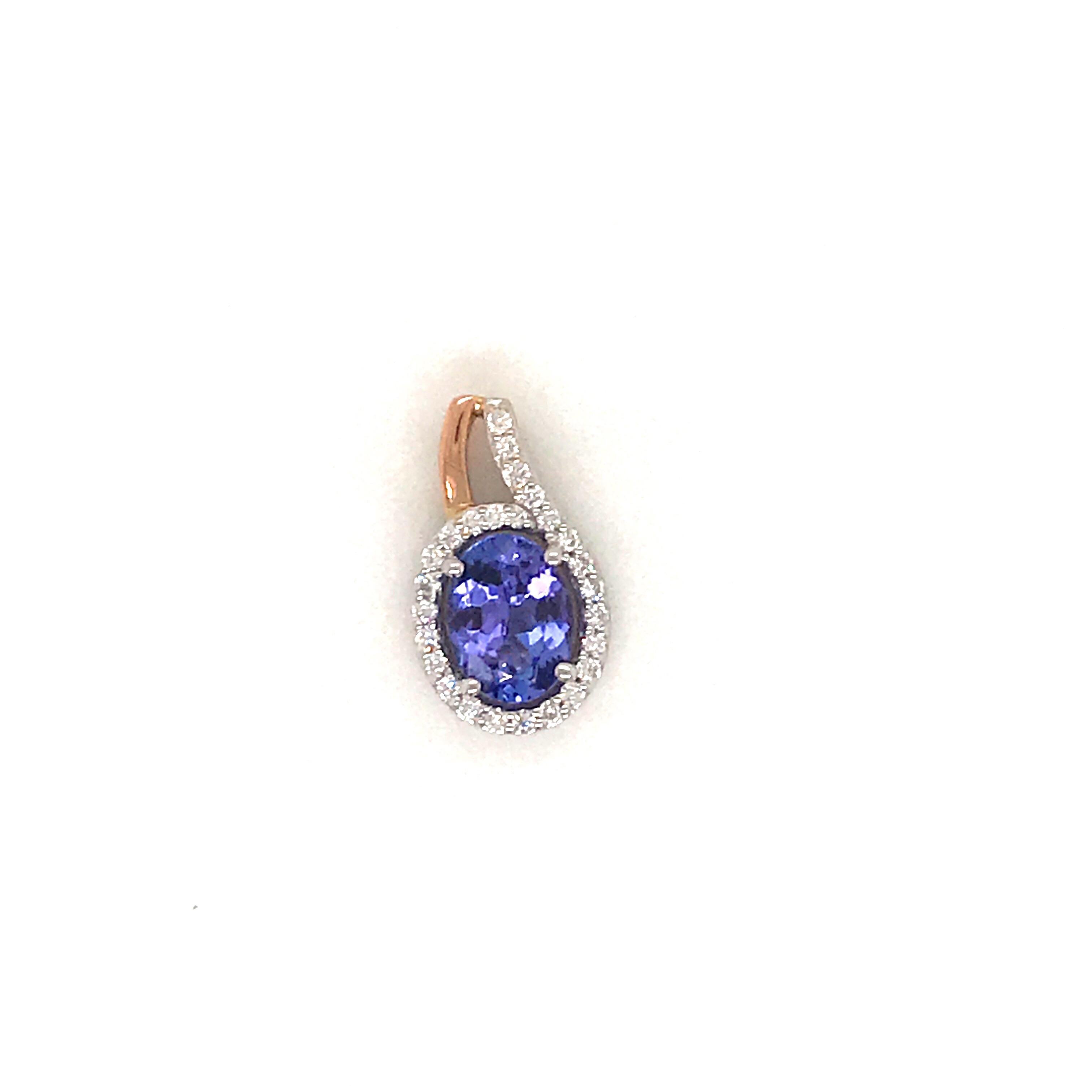 14K White & gold pendant featuring one oval cut Tanzanite weighing 1.30 carats flanked with round brilliants weighing 0.19 carats. Comes with a 16 inch white gold chain. 
Color G
Clarity VS-SI