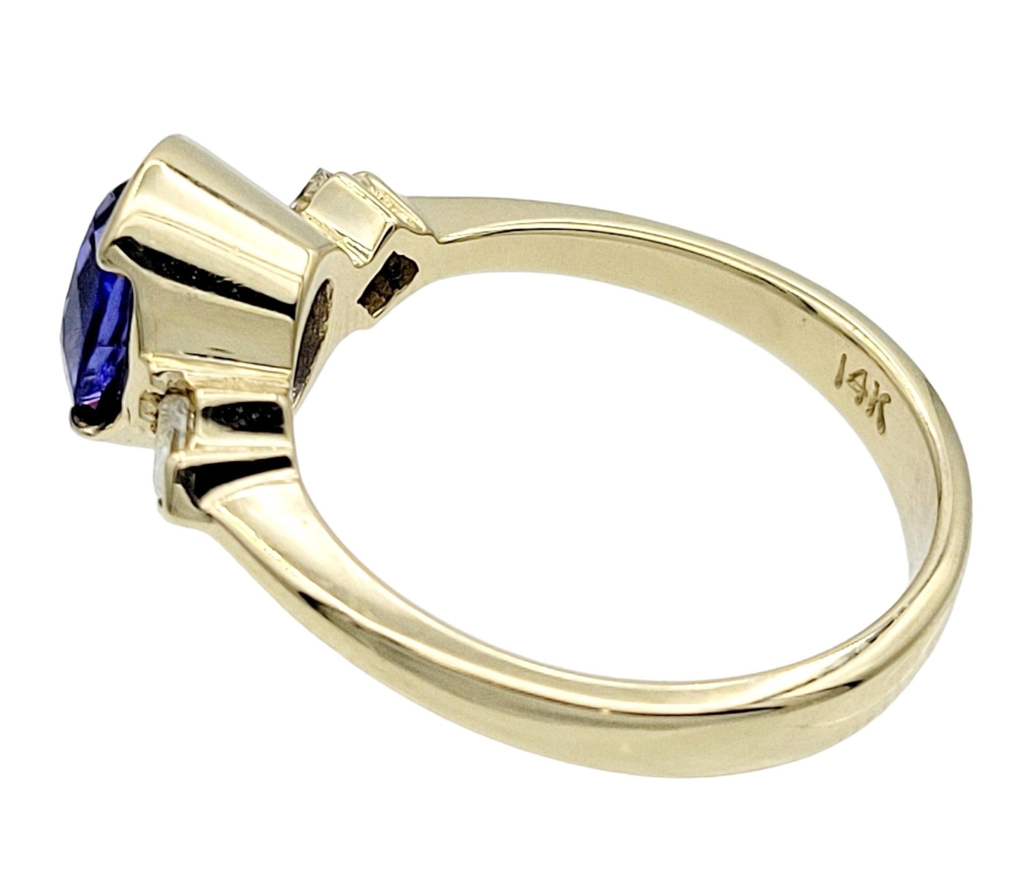 Oval Cut Oval Tanzanite & Square Diamond Three-Stone Band Ring in 14 Karat Yellow Gold For Sale