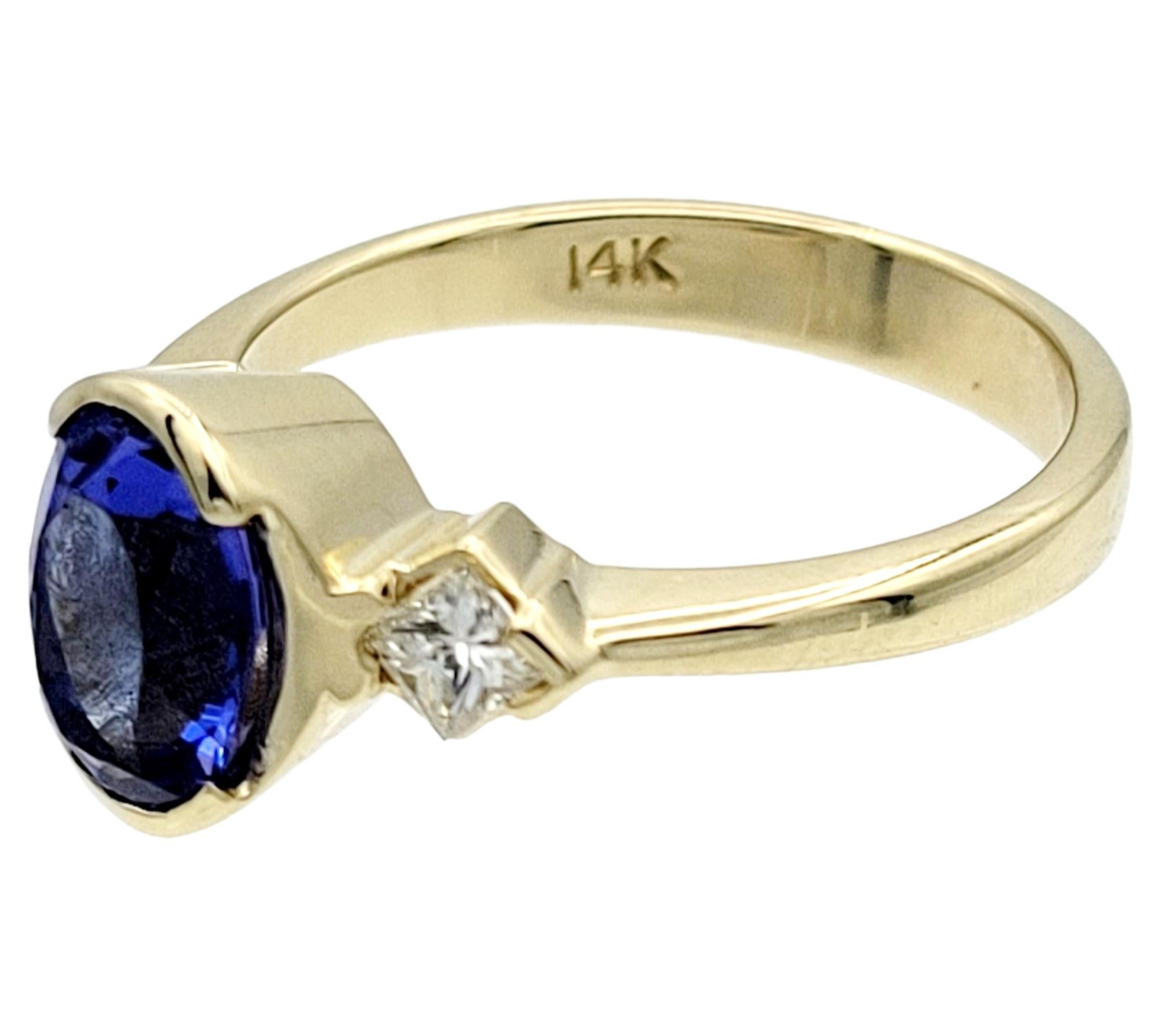 Oval Tanzanite & Square Diamond Three-Stone Band Ring in 14 Karat Yellow Gold In Good Condition For Sale In Scottsdale, AZ