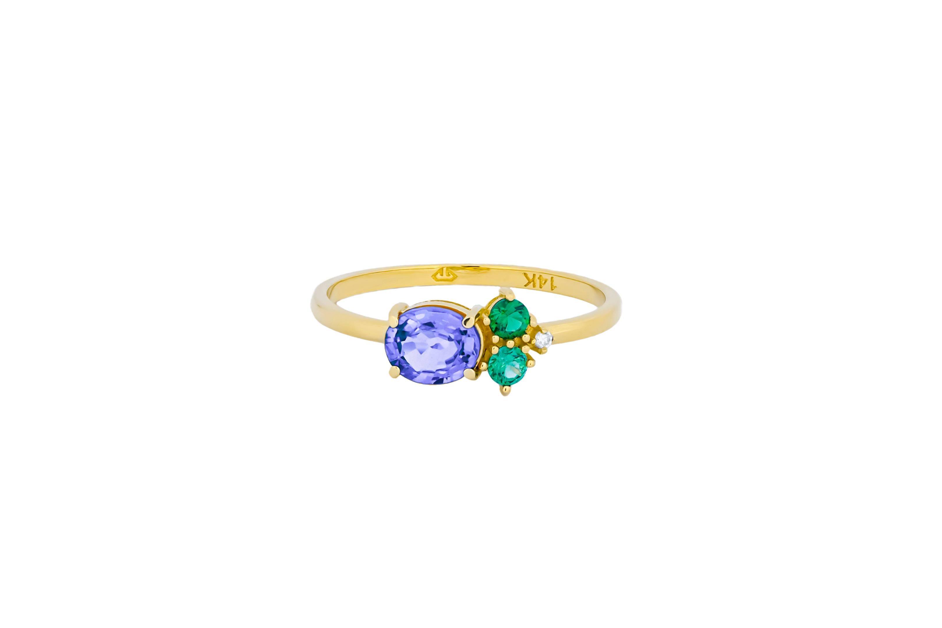 For Sale:  Oval tanzanite, tsavorite and diamonds 14k gold ring. 6