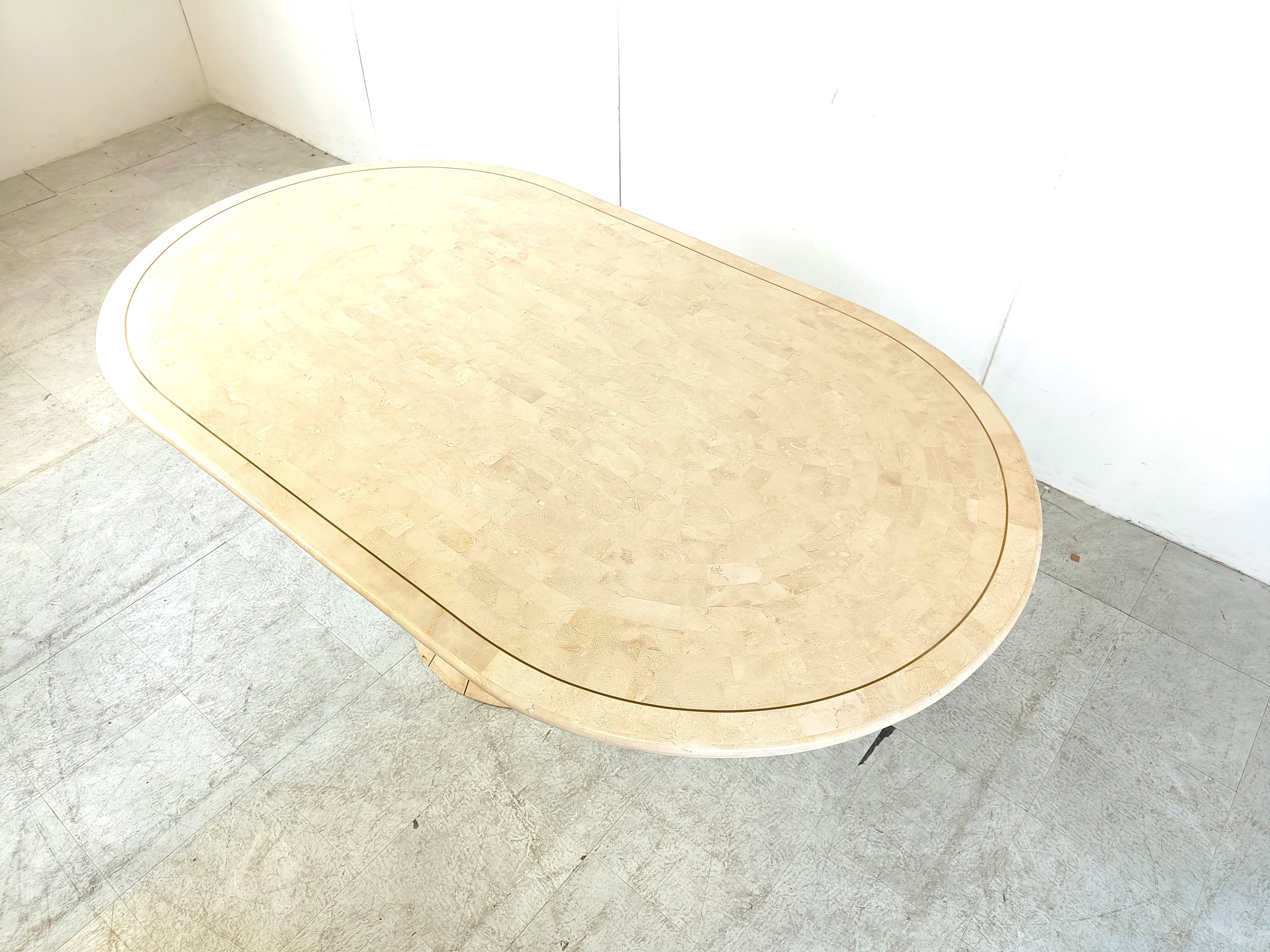 Oval tesselated stone dining table by Maithland smith, 1970s  1