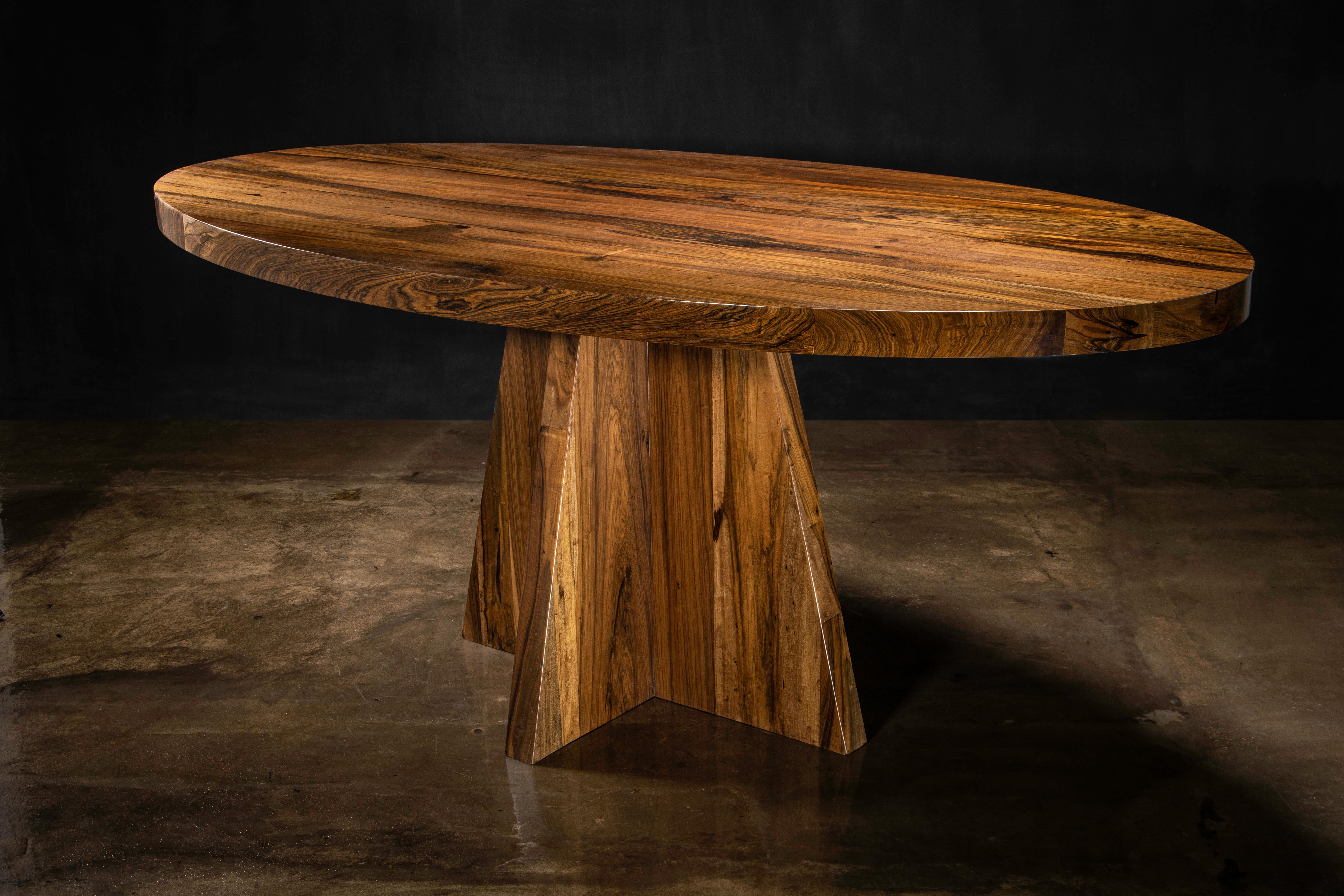 In Stock 

One-of-a-kind Luca Oval Extra Thick Solid Argentine Rosewood Pedestal Dining Table by Costantini

Measurments are 72