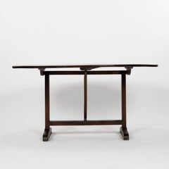Oval Tilt-Top Walnut Table