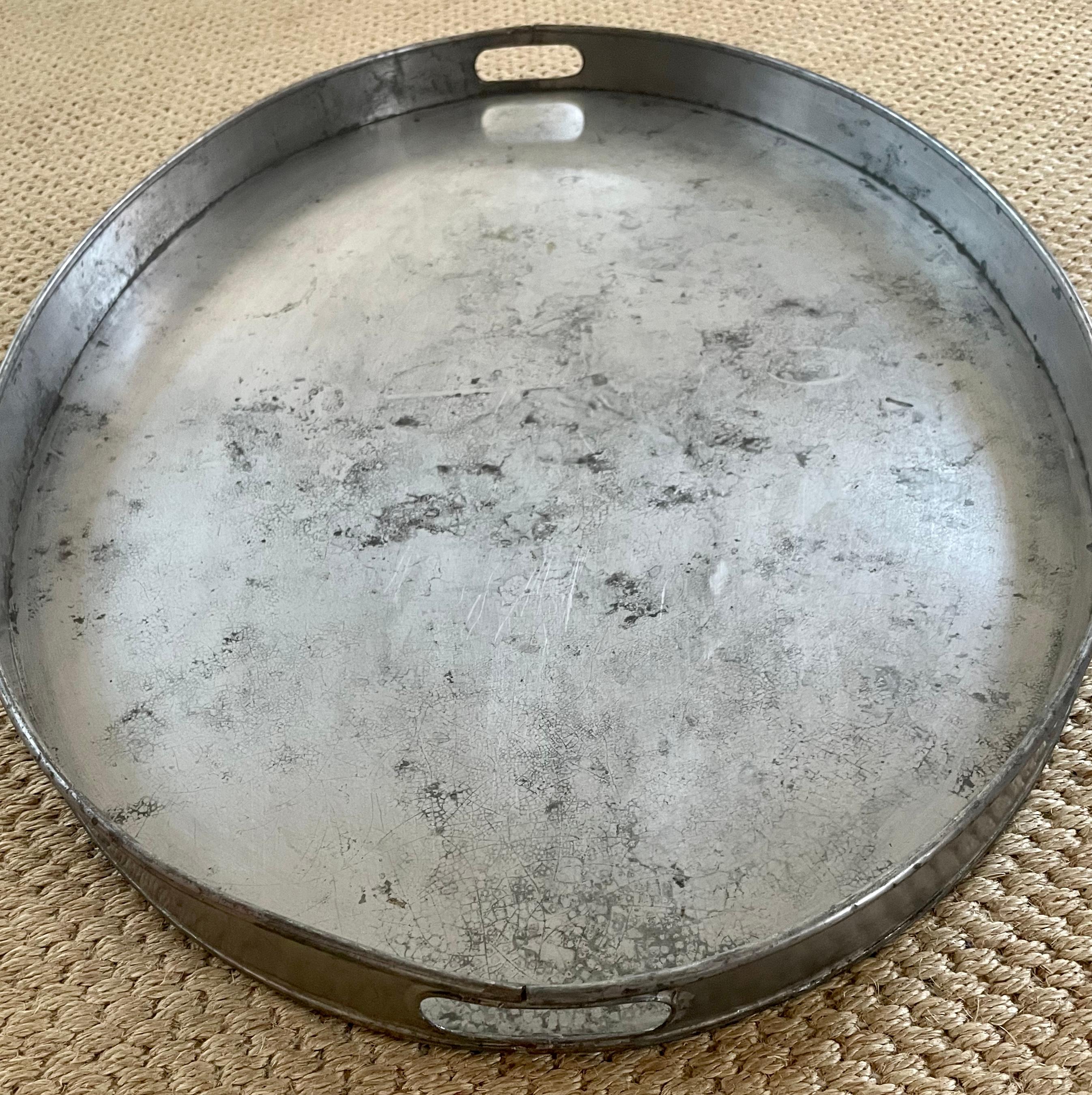 Oval tole tray. Oval tole tray with conforming gallery with punched handles. 
Perfect in contemporary or traditional settings. France, 1920’s 
Dimensions: 27.5