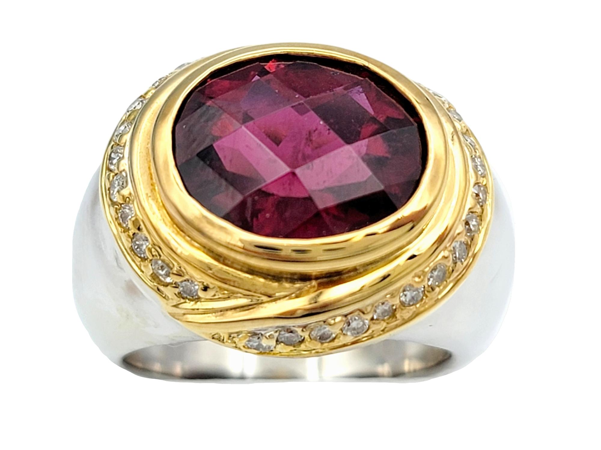Ring size: 5.75

This remarkable ring, with its bold design and vibrant color, takes the classic cocktail ring and gives it a modern twist. The center of attention is a striking 4.73-carat checkerboard oval brilliant cut red tourmaline, cradled
