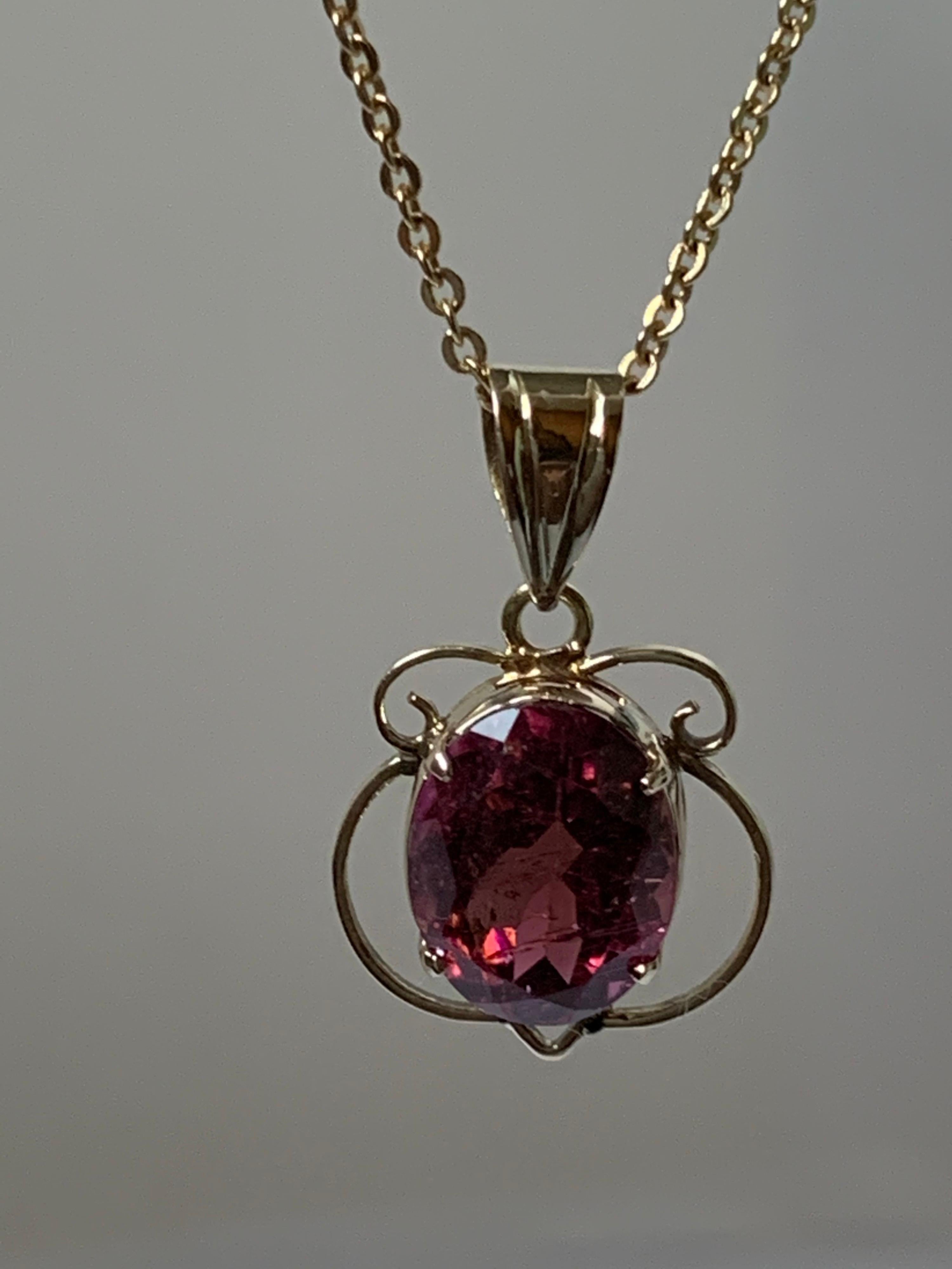 Anglo-Indian Oval Tourmaline Set in 14 Karat Gold Pendant For Sale
