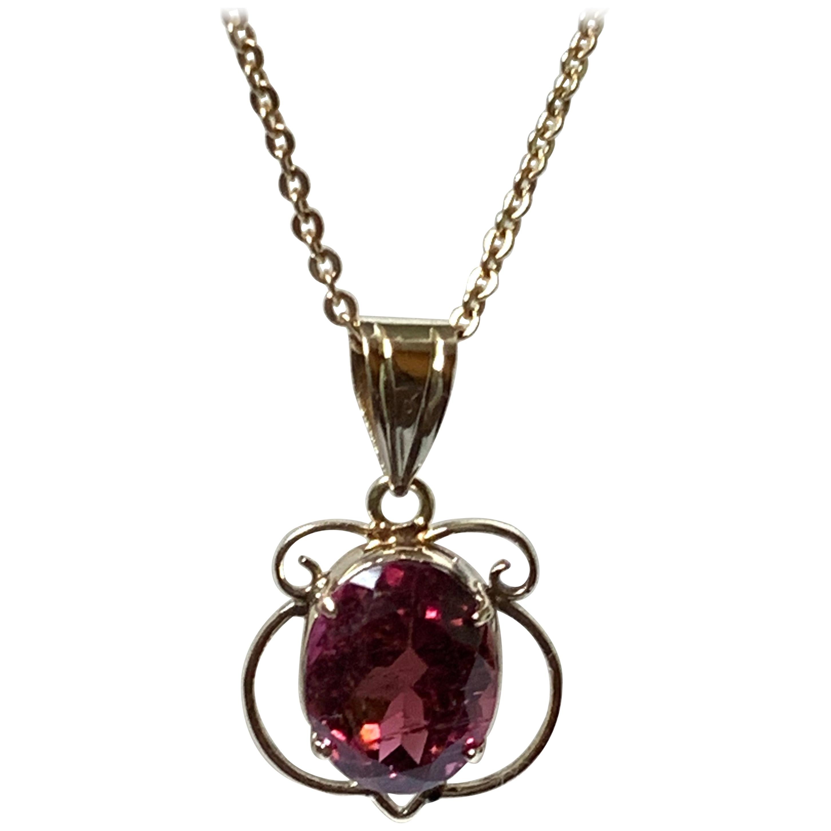 Oval Tourmaline Set in 14 Karat Gold Pendant For Sale