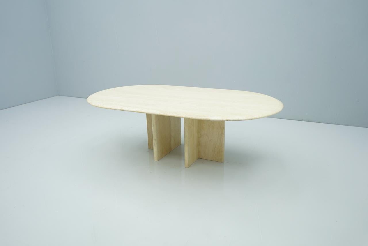 Oval travertine coffee table, Italy, 1970s. Very good condition.