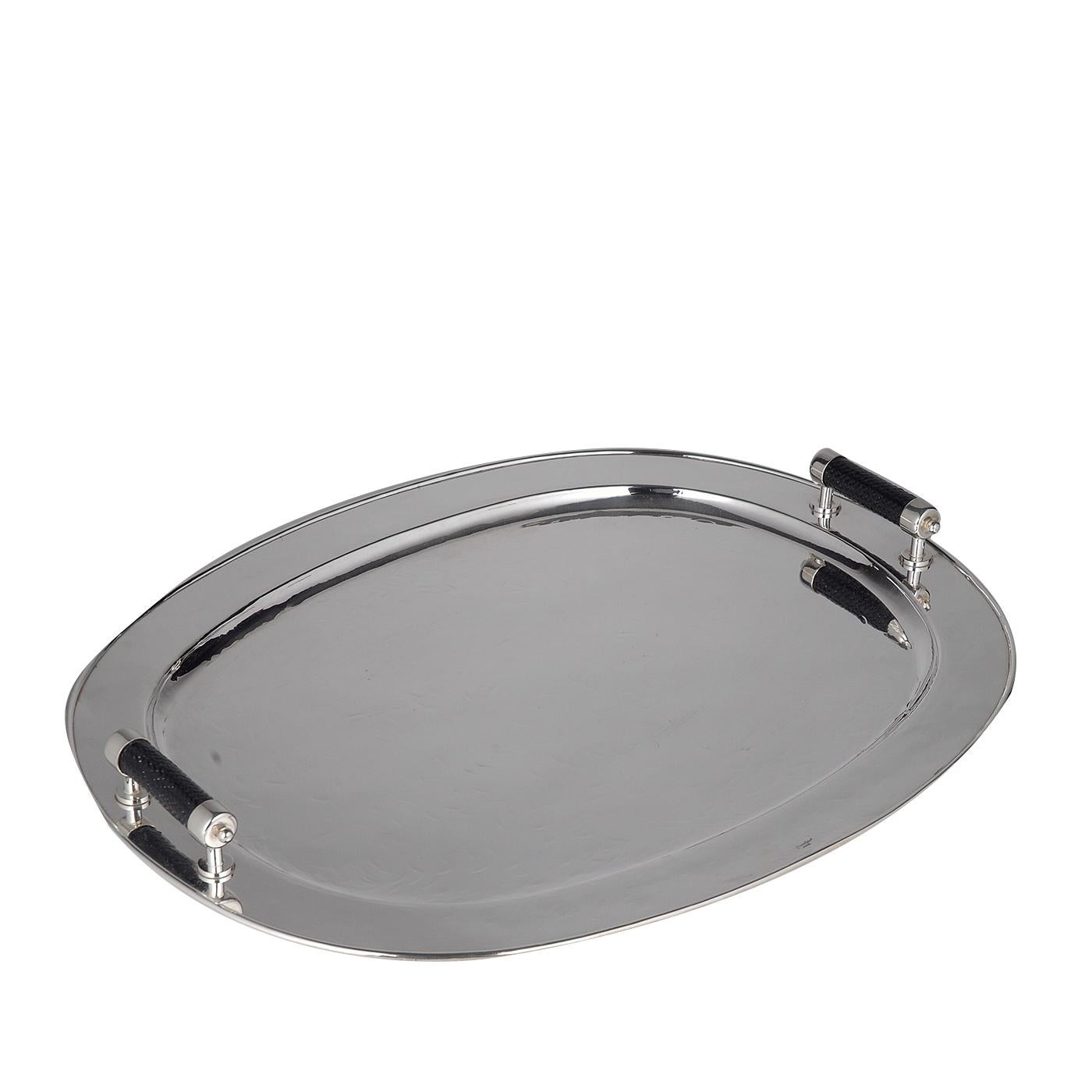 Classic and sophisticated, this tray will complement an elegant decor and can be used in the dining room or living room, either alone or combined with other pieces by the same designers, all in silver plated metal and distinctive for their exquisite