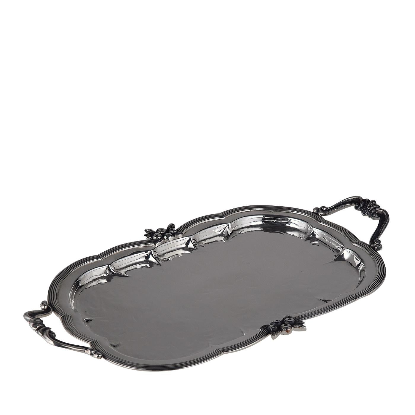 This elegant tray will enrich a table and can be also used as a permanent decorative addition to a console or a coffee table to complement a Classic decor. Its shape with round corners is adorned inside with gentle semi-circular dents, while the