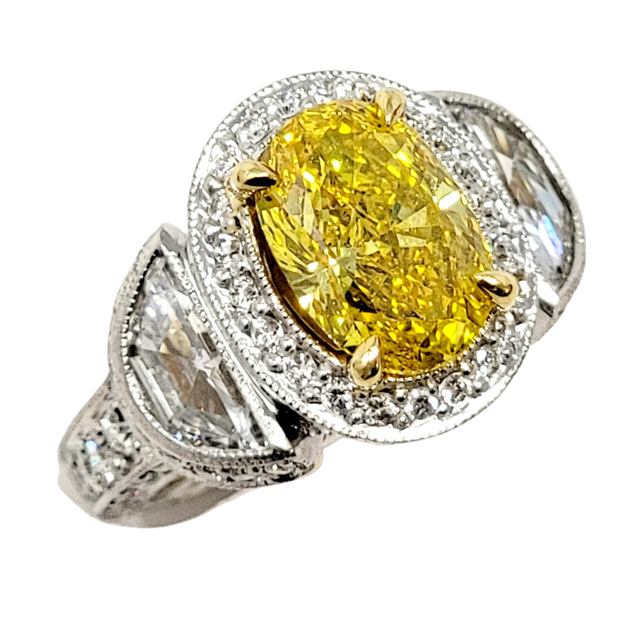 Ring size: 4

This extraordinarily elegant engagement ring will absolutely take your breath away! An exquisite natural yellow diamond is paired with glittering white diamonds for an absolute work of art.  The incredible saturated yellow stone set