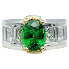 Anello con gambo europeo in granato ovale Tsavorite e ponte di diamanti in oro 18 carati