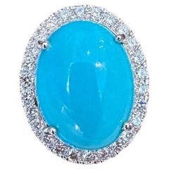 Oval Turquoise and Diamond Halo Ring in 18k White Gold
