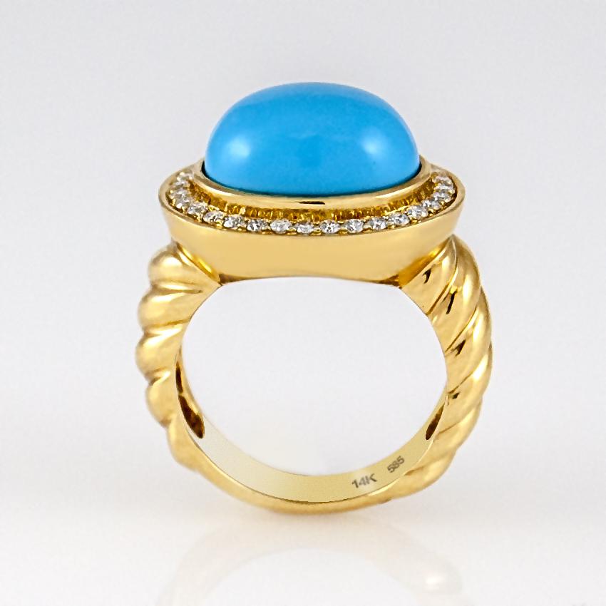 Beautiful oval shape cabochon turquoise ring surrounded by .37 carats of diamonds set in 14 karat yellow gold in twisted ropes style. This women's cocktail statement ring is available in stock. It is in size 7 and if needed it can be resized.
