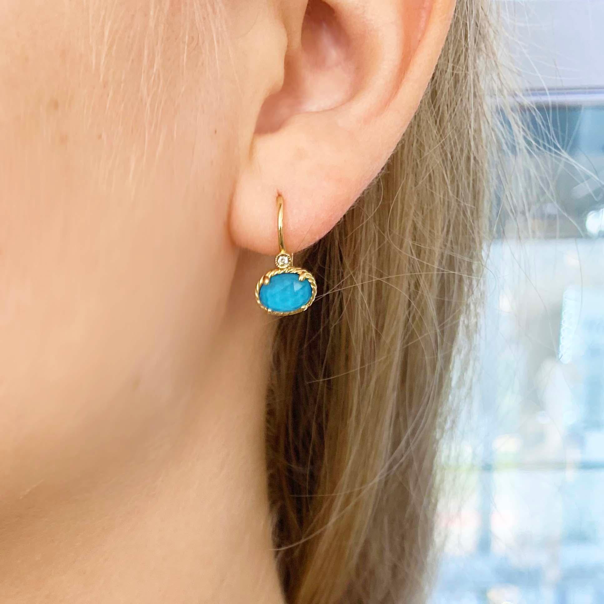 These 14kt yellow gold, adorable turquoise and diamond earrings are bold and beautiful! With a genuine piece of natural turquoise set under a faceted clear quartz gemstone. The clear quartz adds an extra layer to the turquoise and makes the overall