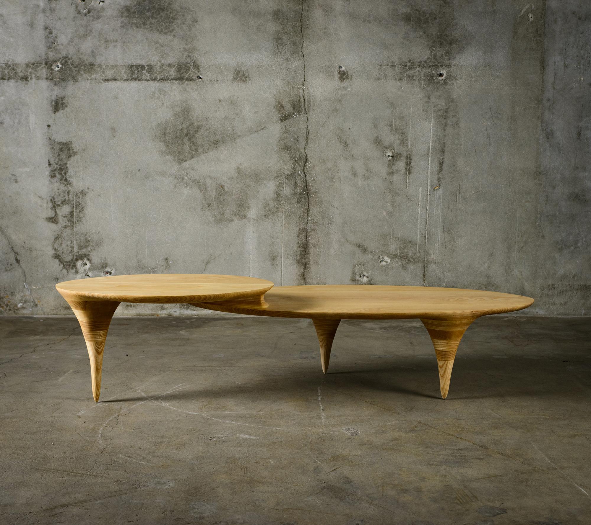 Michael Wilson two-level coffee table in oval form.