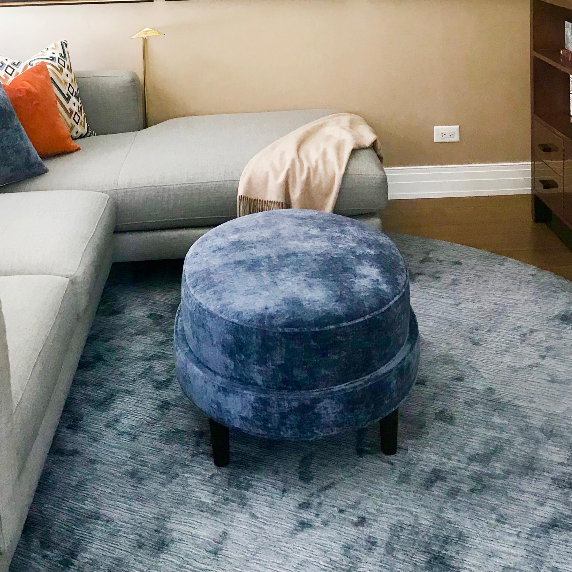 oval upholstered ottoman