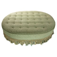 Pouf ovale tapissé
