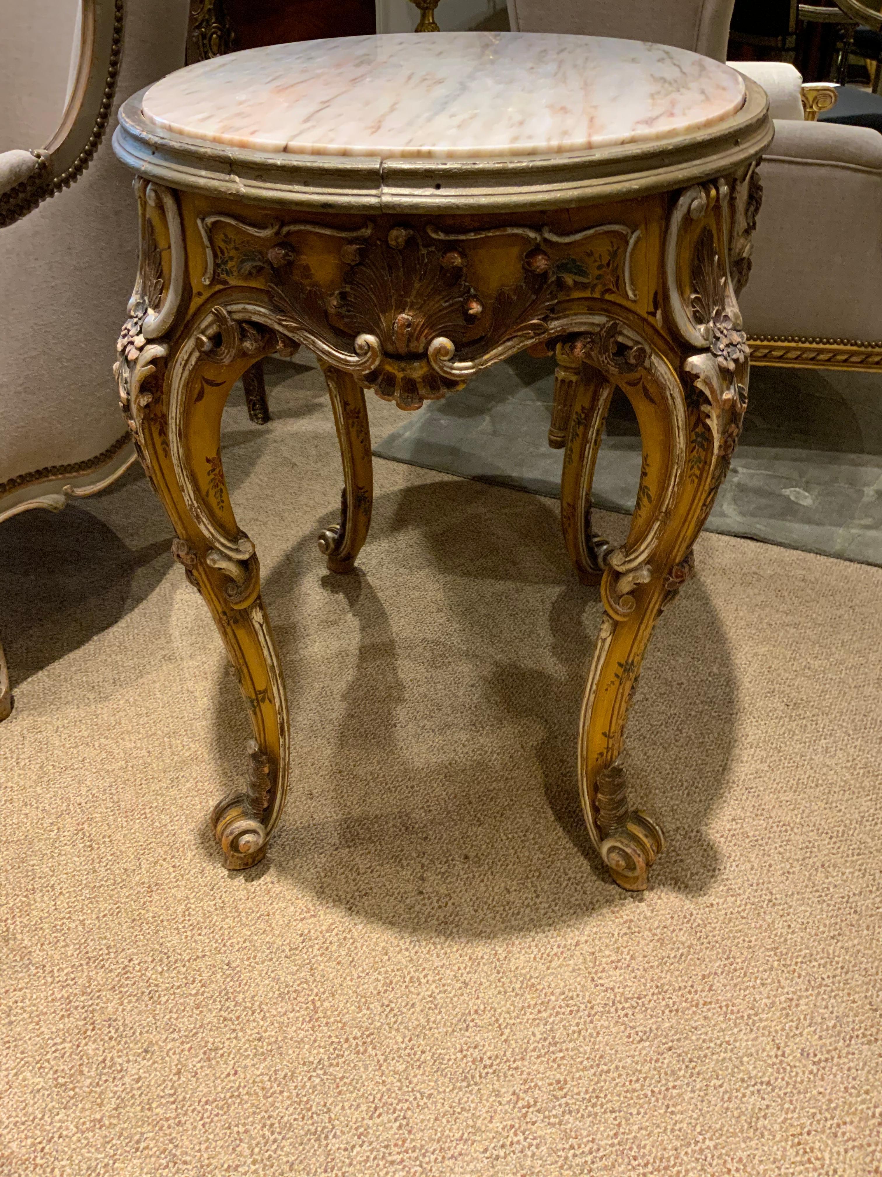Harewood Oval Venetian Carved and Polychrome Table with a Cream, Gold and Pale Gray Veins For Sale