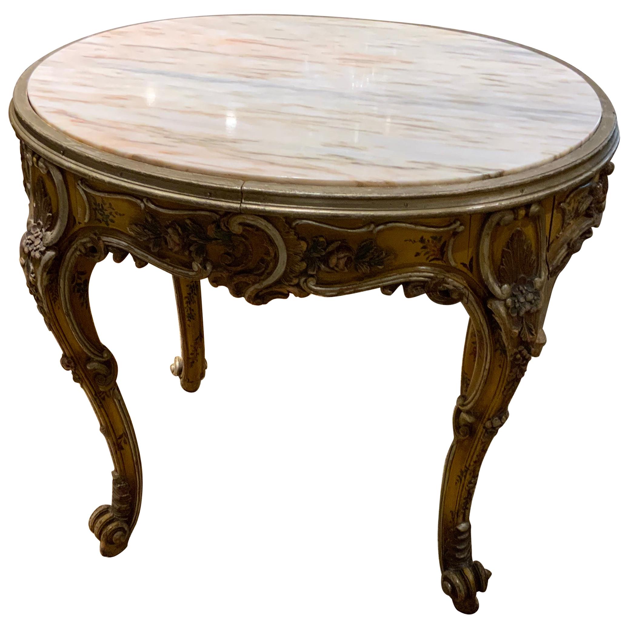 Oval Venetian Carved and Polychrome Table with a Cream, Gold and Pale Gray Veins For Sale