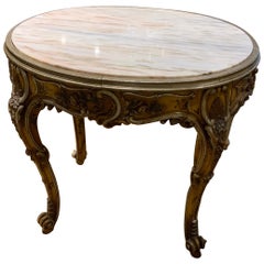 Oval Venetian Carved and Polychrome Table with a Cream, Gold and Pale Gray Veins