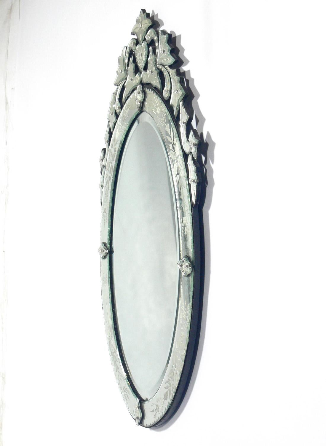 Oval Venetian mirror, Italy, circa 1950s. Retains warm original patina to original mirrored glass.