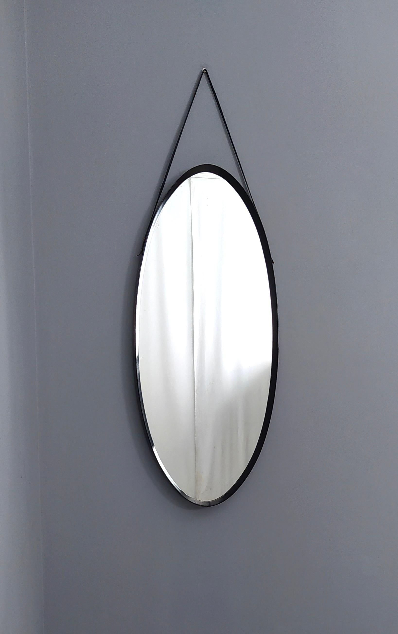 Italian Oval Vintage Wall Mirror with Ebonized Wood Frame and a Leather Hook, Italy For Sale