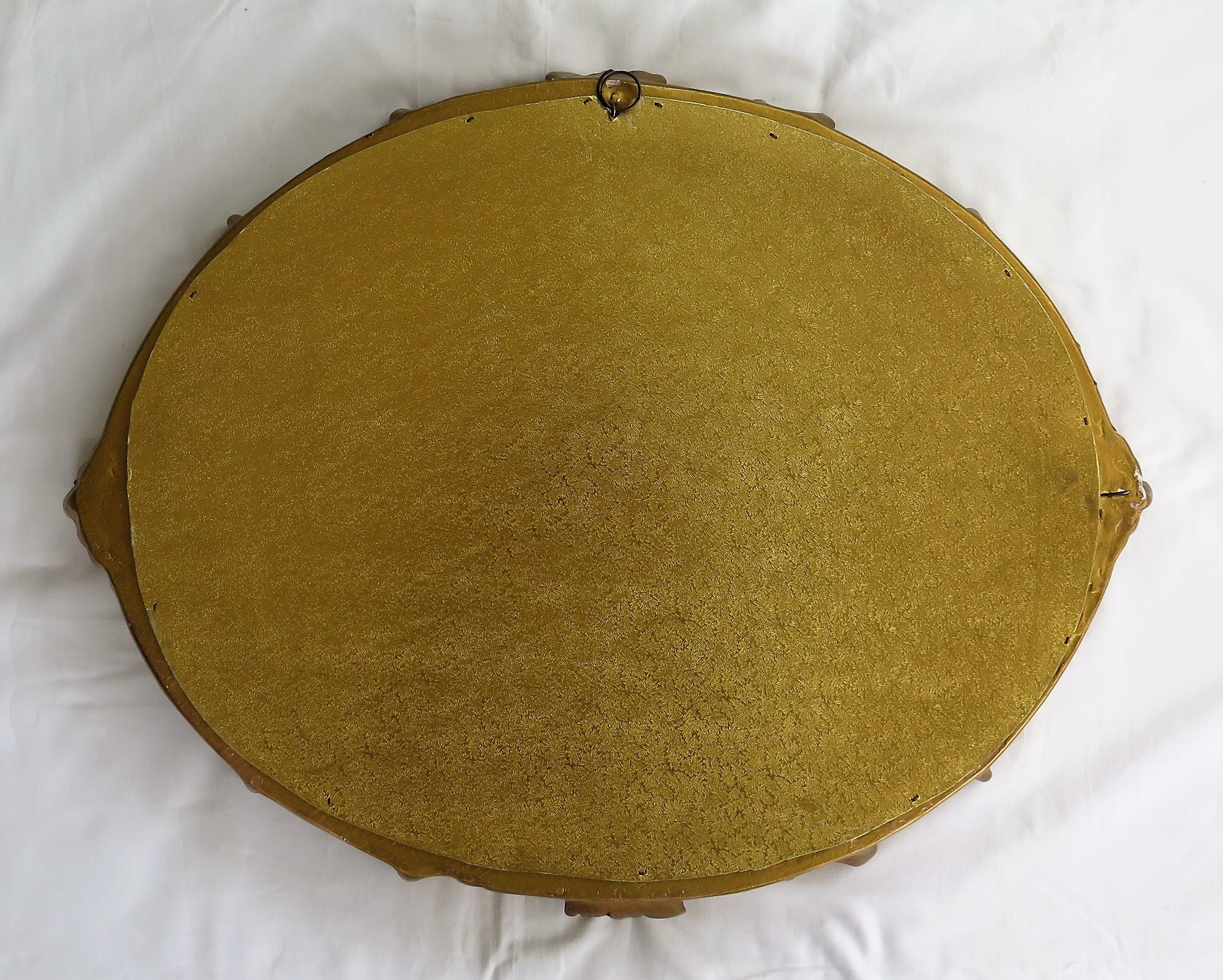 Oval Wall Mirror with Rococo Gold Finish Frame of Gesso on Wood, circa 1930 10