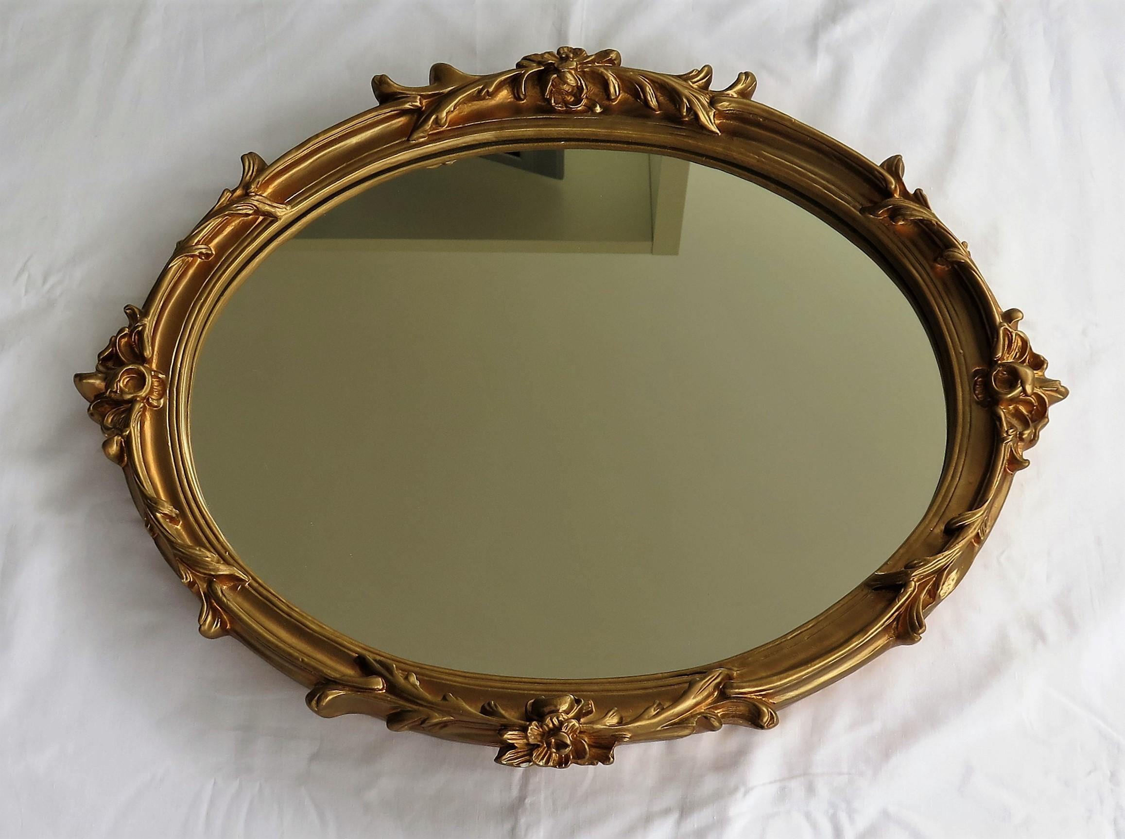 English Oval Wall Mirror with Rococo Gold Finish Frame of Gesso on Wood, circa 1930
