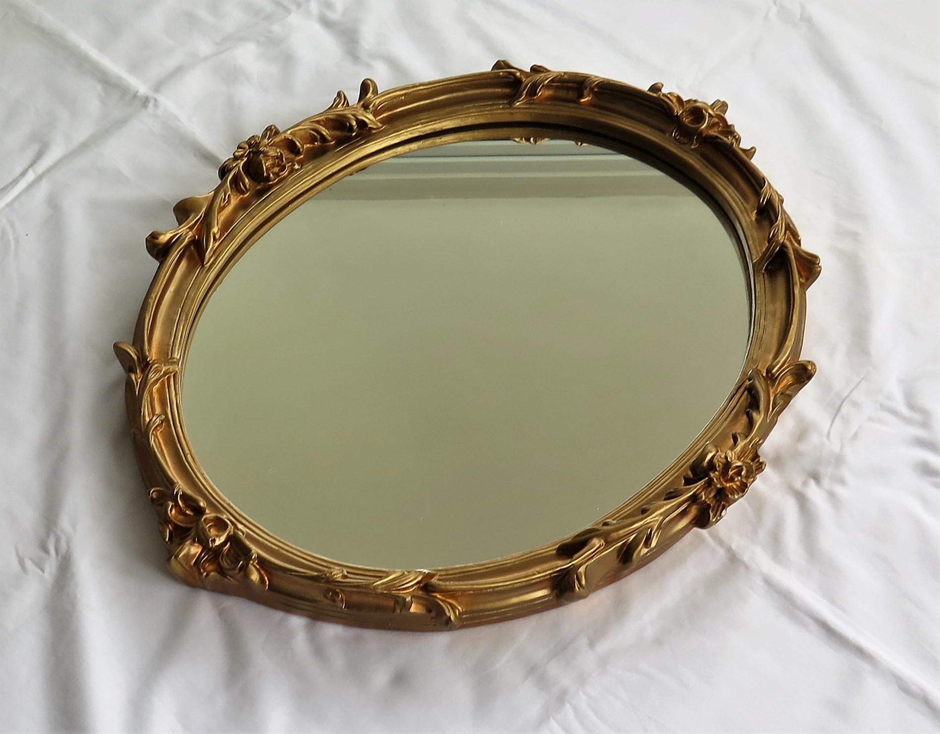 Molded Oval Wall Mirror with Rococo Gold Finish Frame of Gesso on Wood, circa 1930