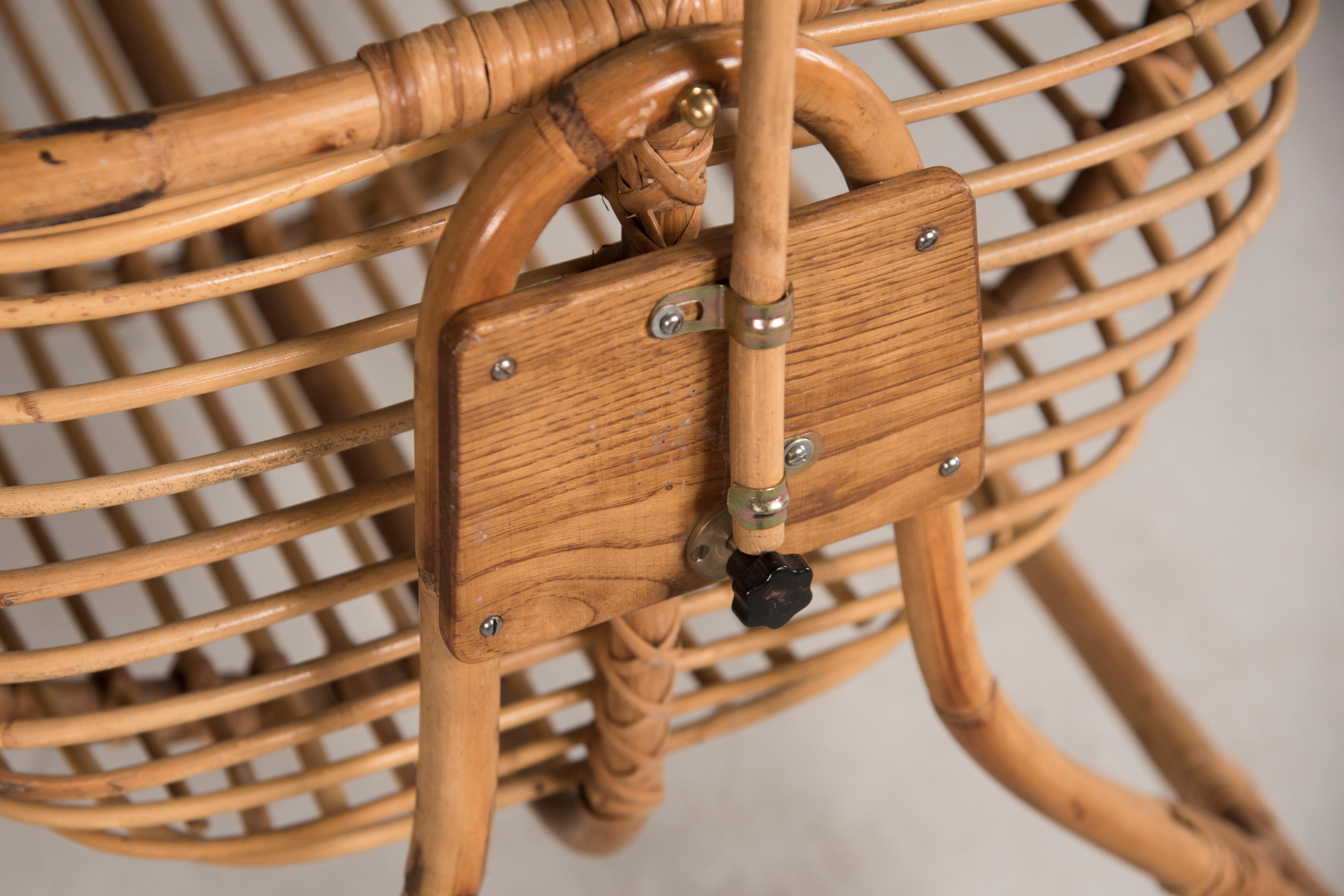 20th Century Oval Wheeled Swinging Rattan Baby Crib form 1970s 