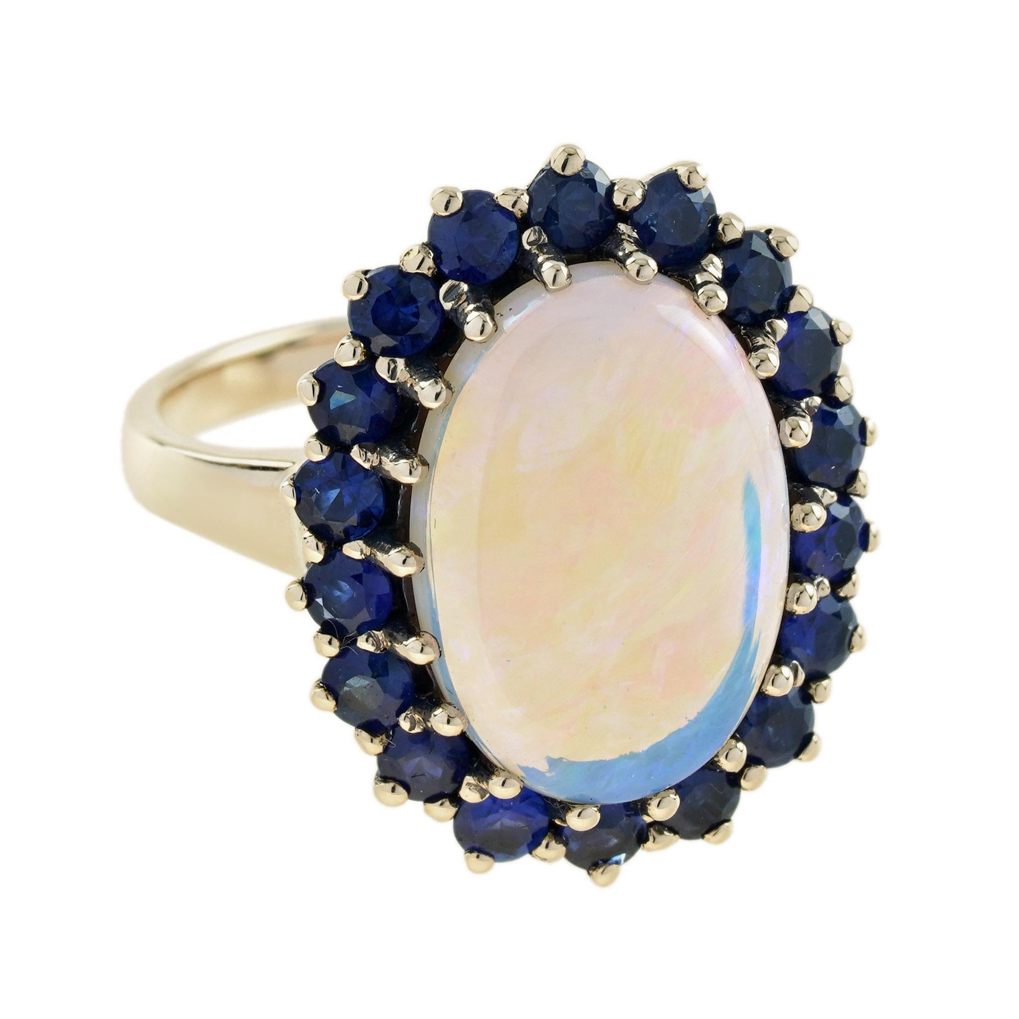 This beautiful ring is a classic vintage inspired style, the halo ring features play-of-color oval 3.43 carat opal for its center, surrounded by eight-teen blue sapphires. This would make a wonderful statement ring.
Ring Information
Style:
