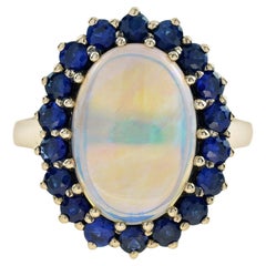 Oval White Opal with Blue Sapphire Vintage Style 9KT Yellow Gold Halo Set Ring
