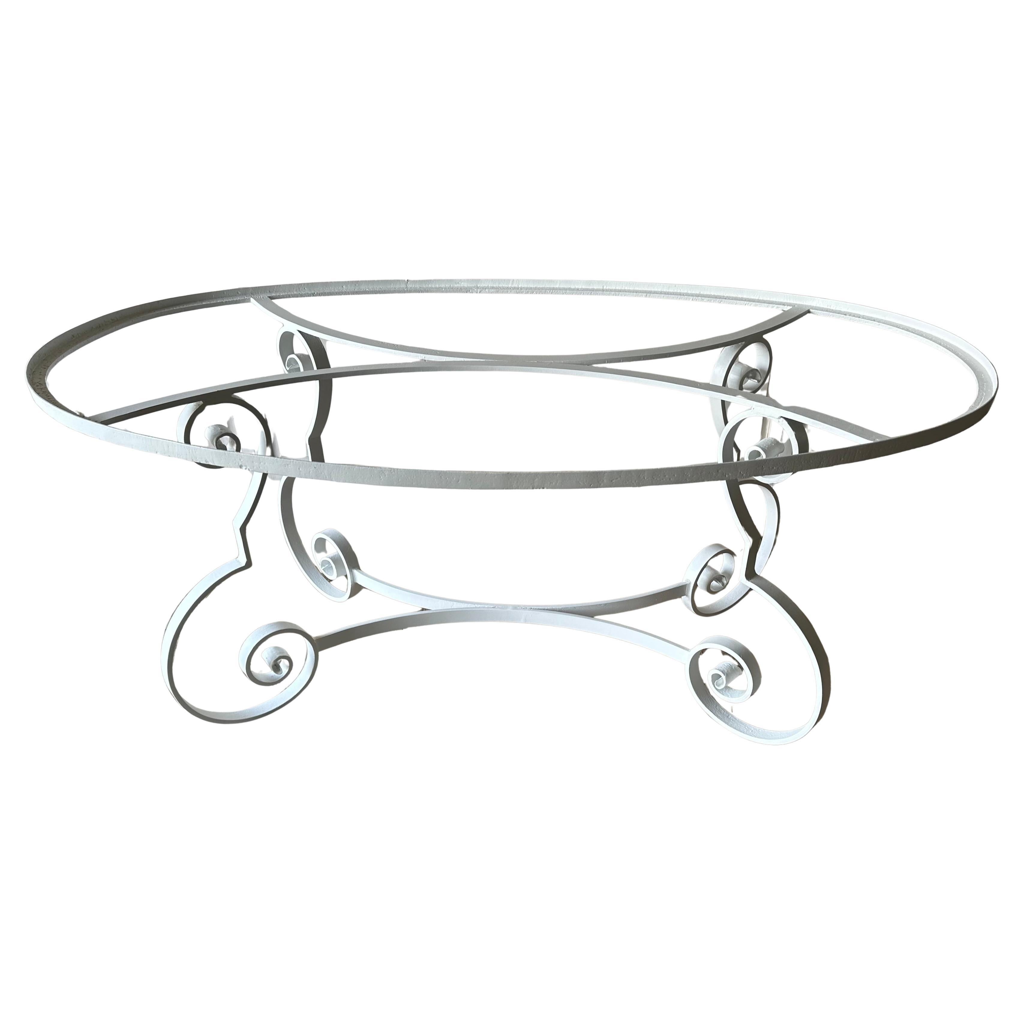Indoor or outdoor mid-century oval metal garden table base.  Add an inset glass top or a larger oval or rectangular top to suit your needs.. The base is designed with Baroque scroll legs and curved braces that match the curved braces supporting the