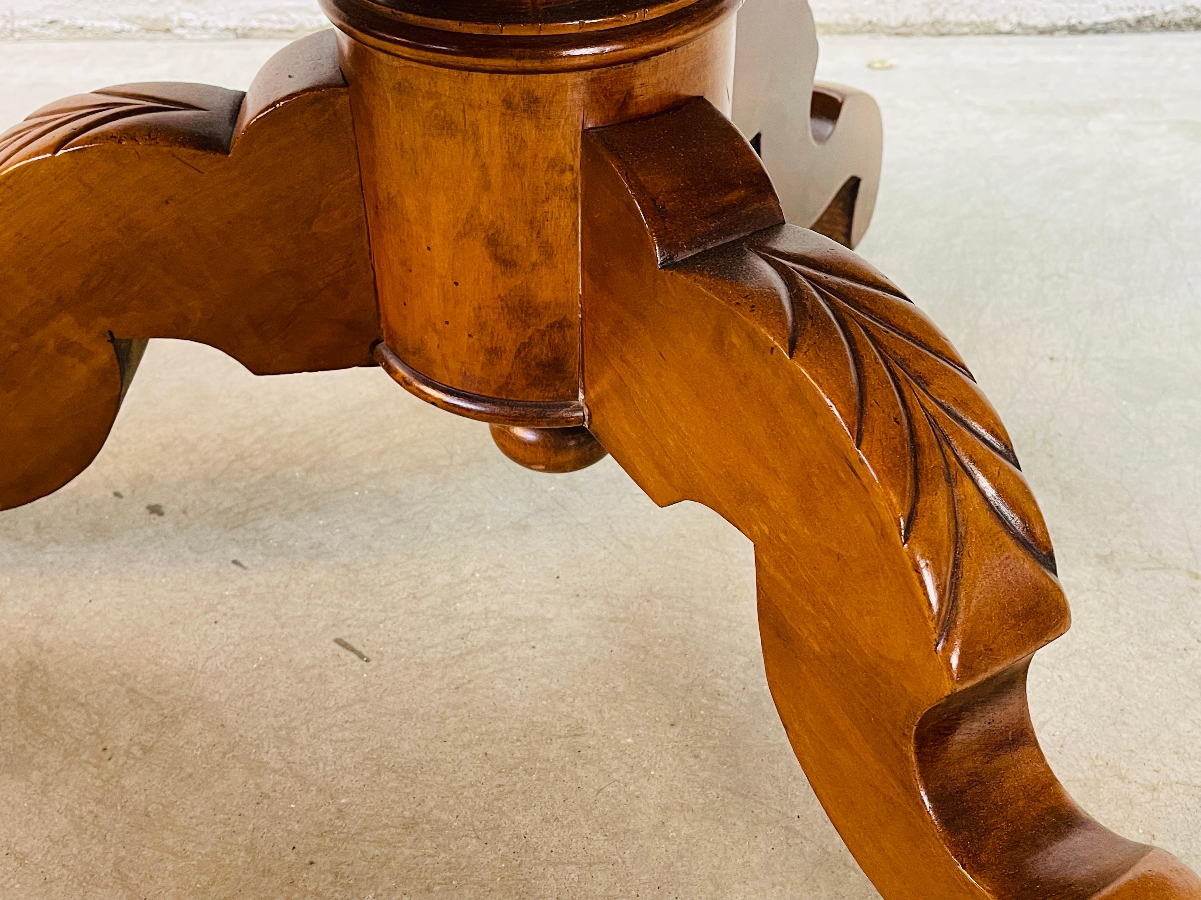 Vintage rustic pine wood oval coffee table with carved legs. Nice pine wood grain and in refinished condition. Table is solid and sturdy. Legs are hand carved. No marks.