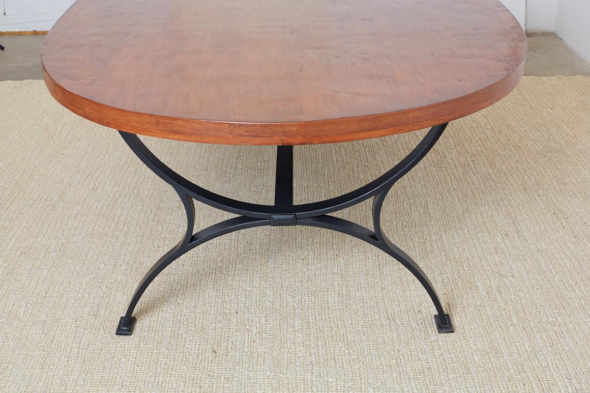 Oval Wooden Dining Table with Curule Iron Base 3