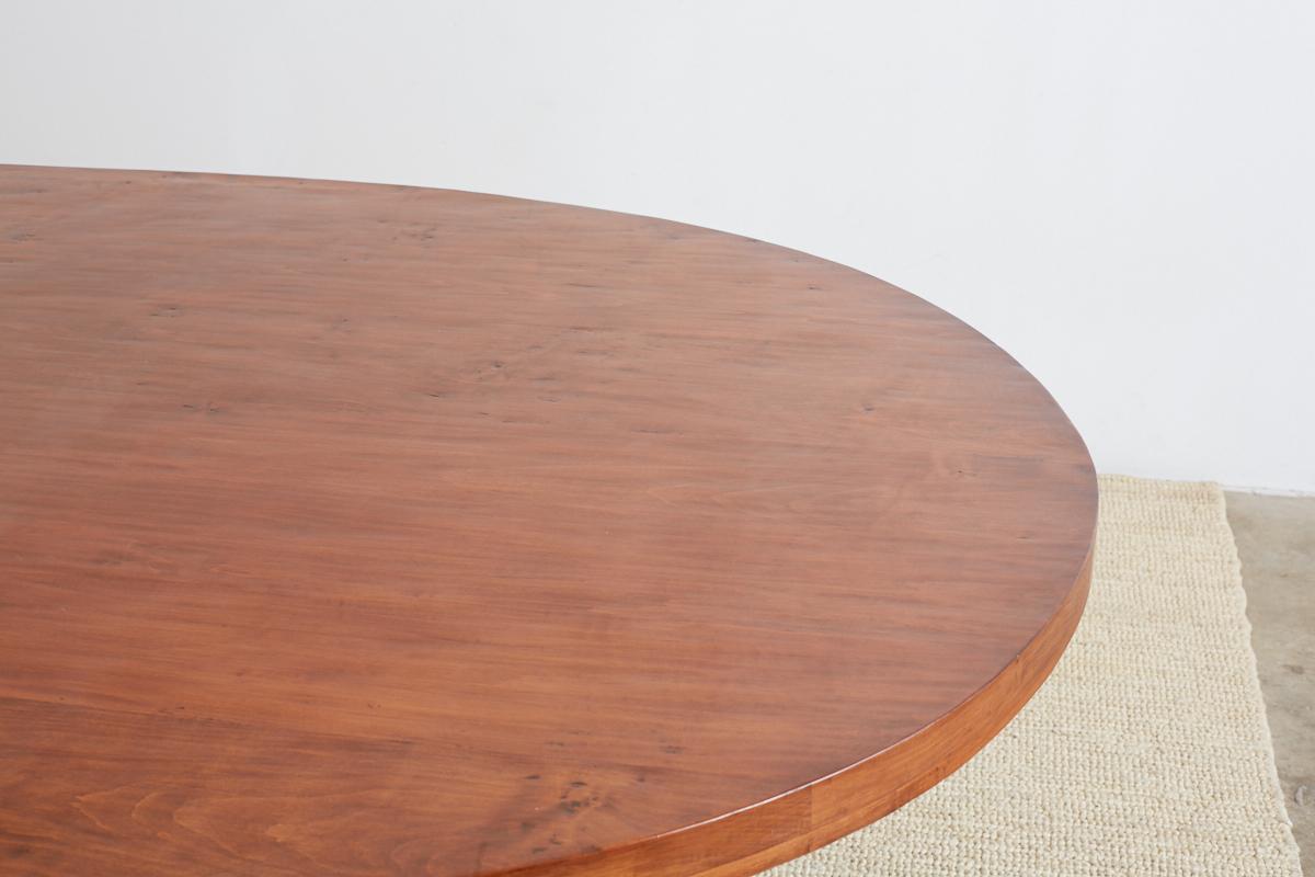 Oval Wooden Dining Table with Curule Iron Base 5