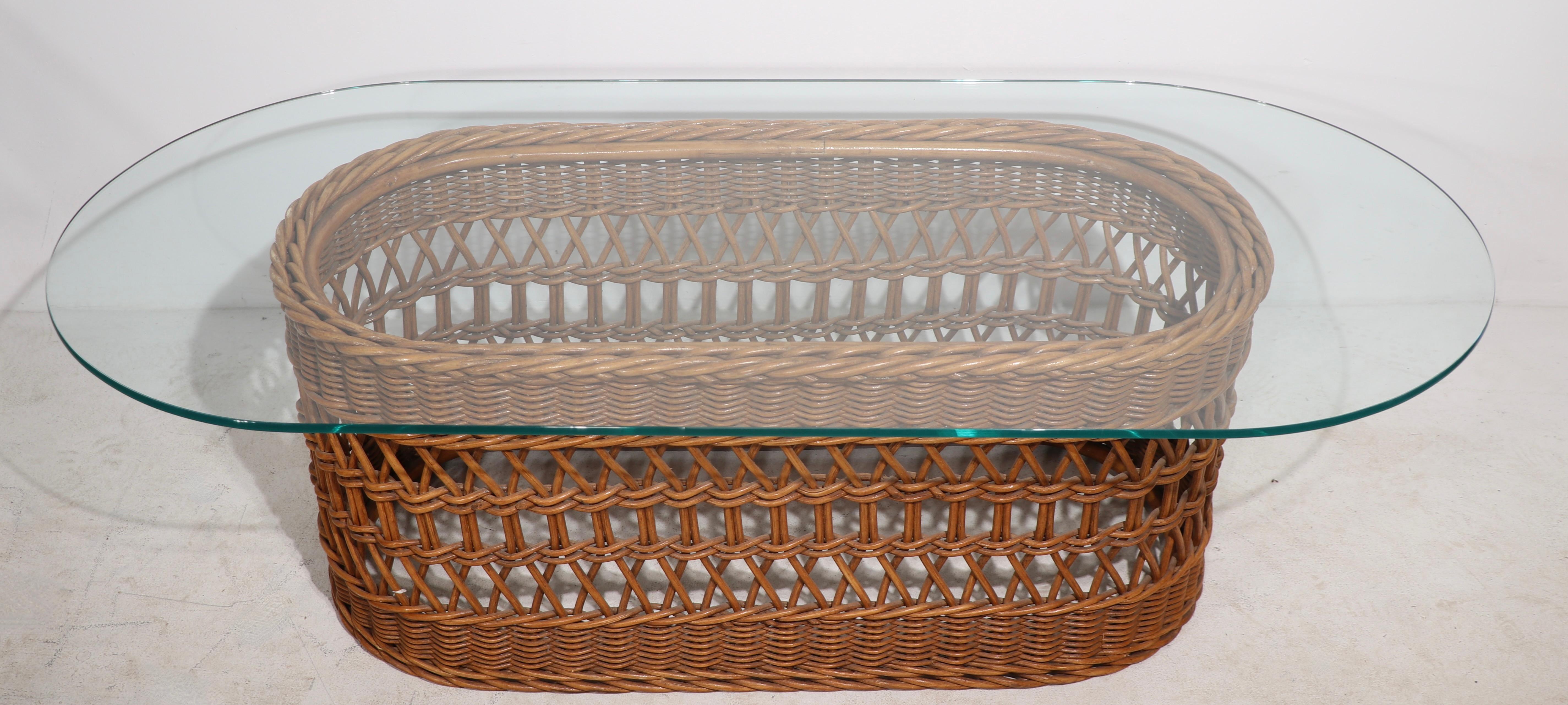 Mid-Century Modern  Oval Woven Wicker and Glass Coffee Table circa 1970's For Sale