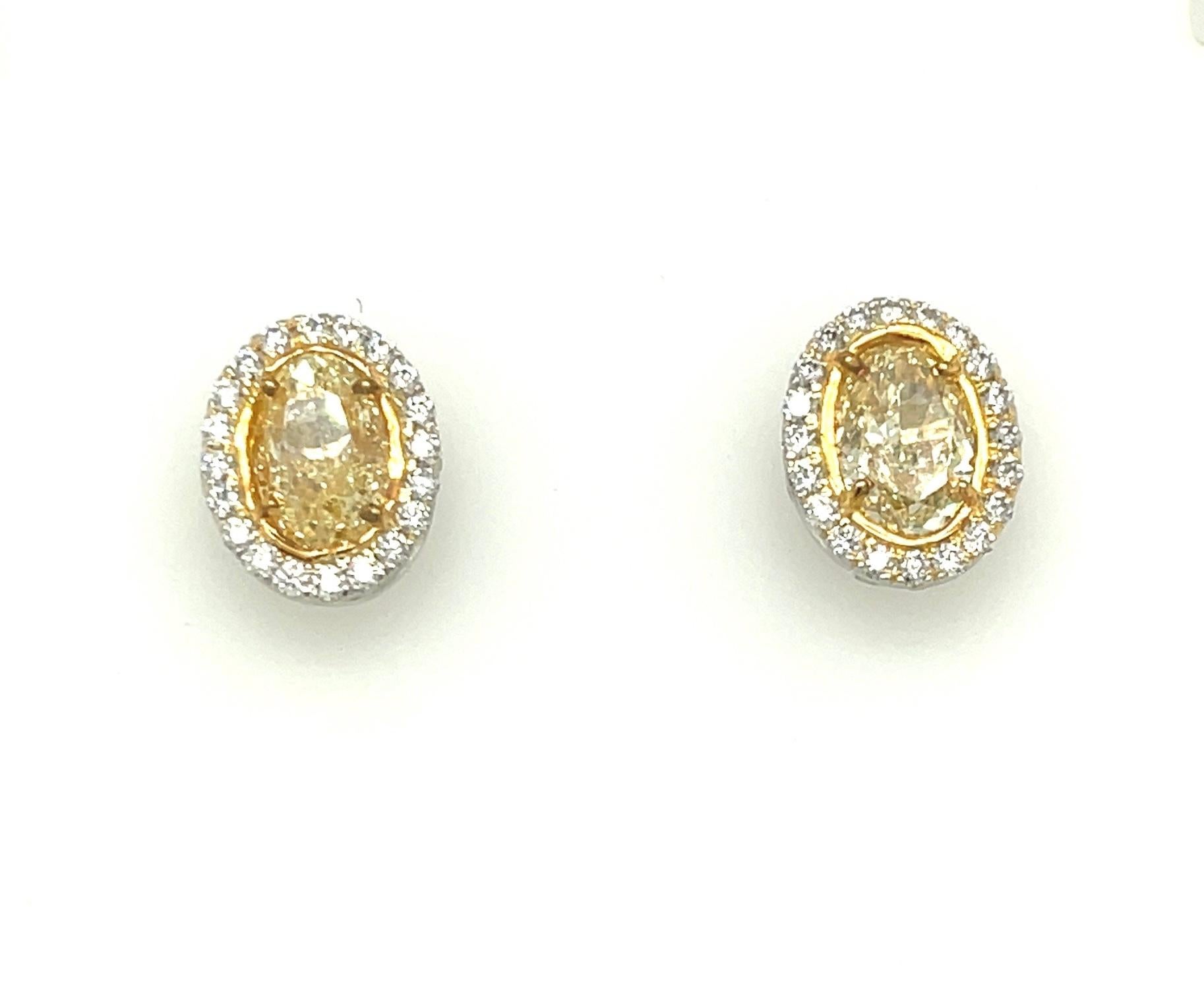Contemporary Oval Yellow Diamond Earrings 3.13 Carats GIA Certified Platinum / 18 KYG For Sale
