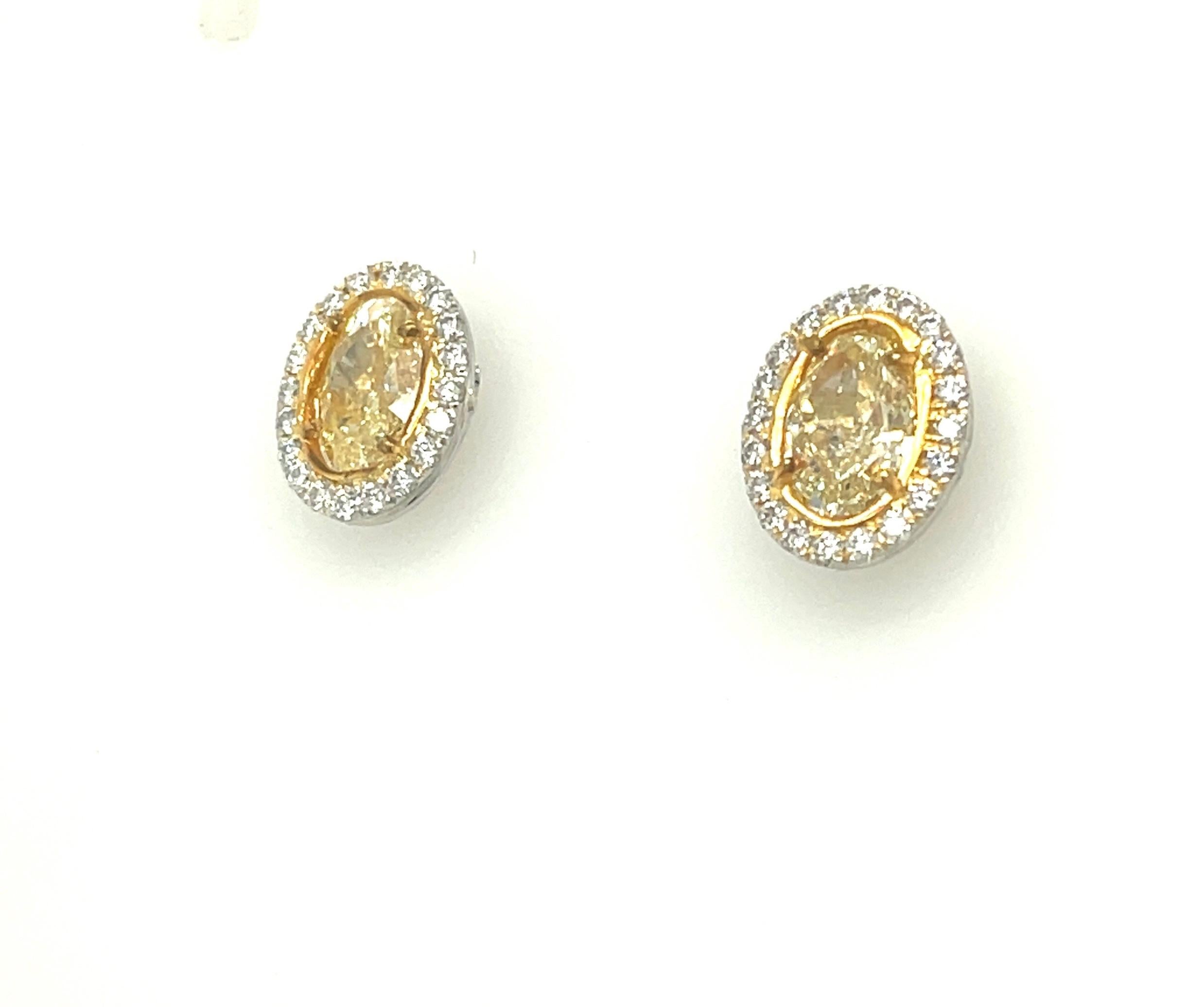 Oval Cut Oval Yellow Diamond Earrings 3.13 Carats GIA Certified Platinum / 18 KYG For Sale