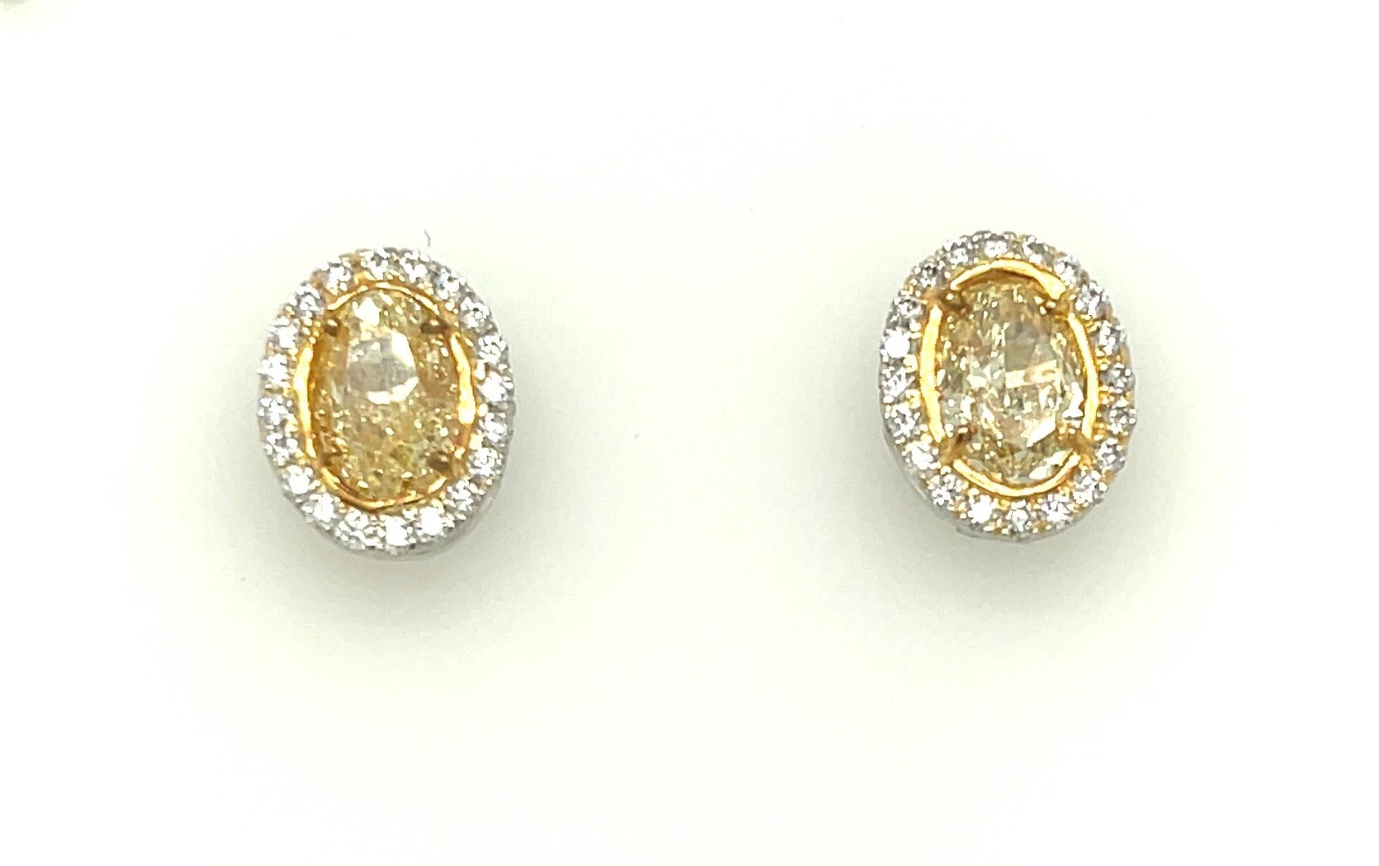 Women's Oval Yellow Diamond Earrings 3.13 Carats GIA Certified Platinum / 18 KYG For Sale