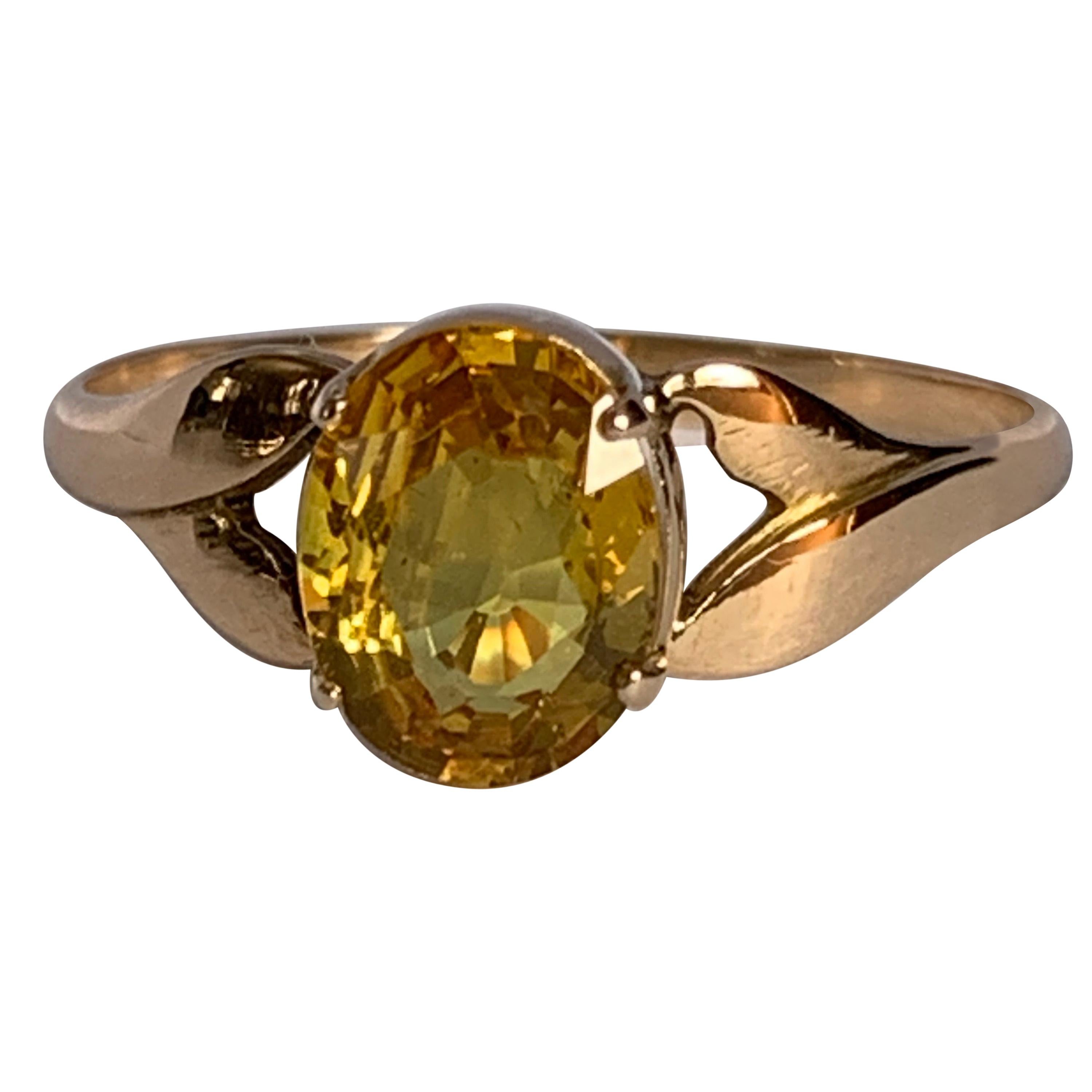 Oval Yellow Sapphire Set in 14 Karat Yellow Gold Ring