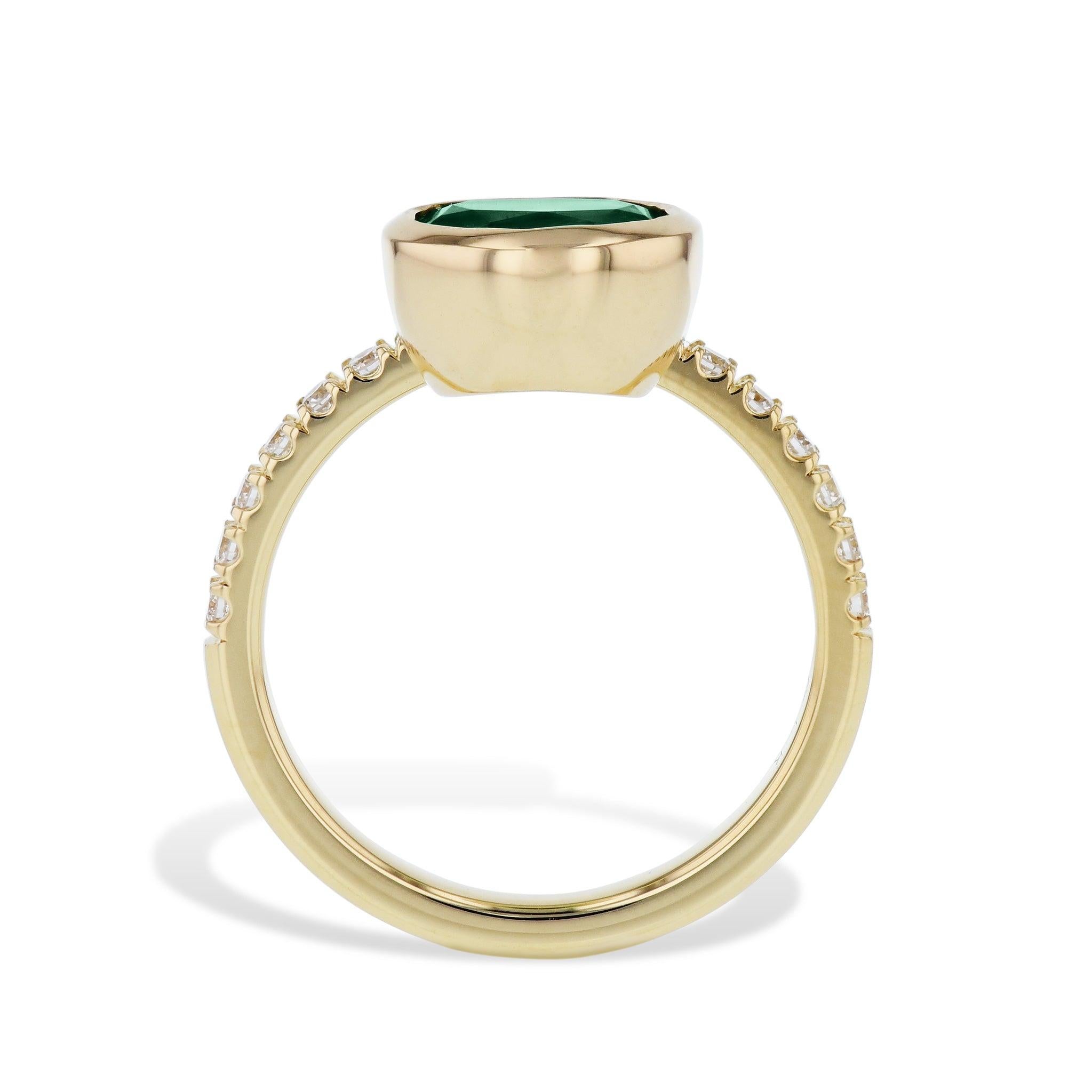 Be enthralled by this captivating 18kt Yellow Gold Oval Zambian Emerald and Pave Diamond Ring. Adorning the bezel set Oval Cut Zambian Emerald is diamond band. Handcrafted to perfection, this exquisite size 6.75 piece is sure to become a treasured
