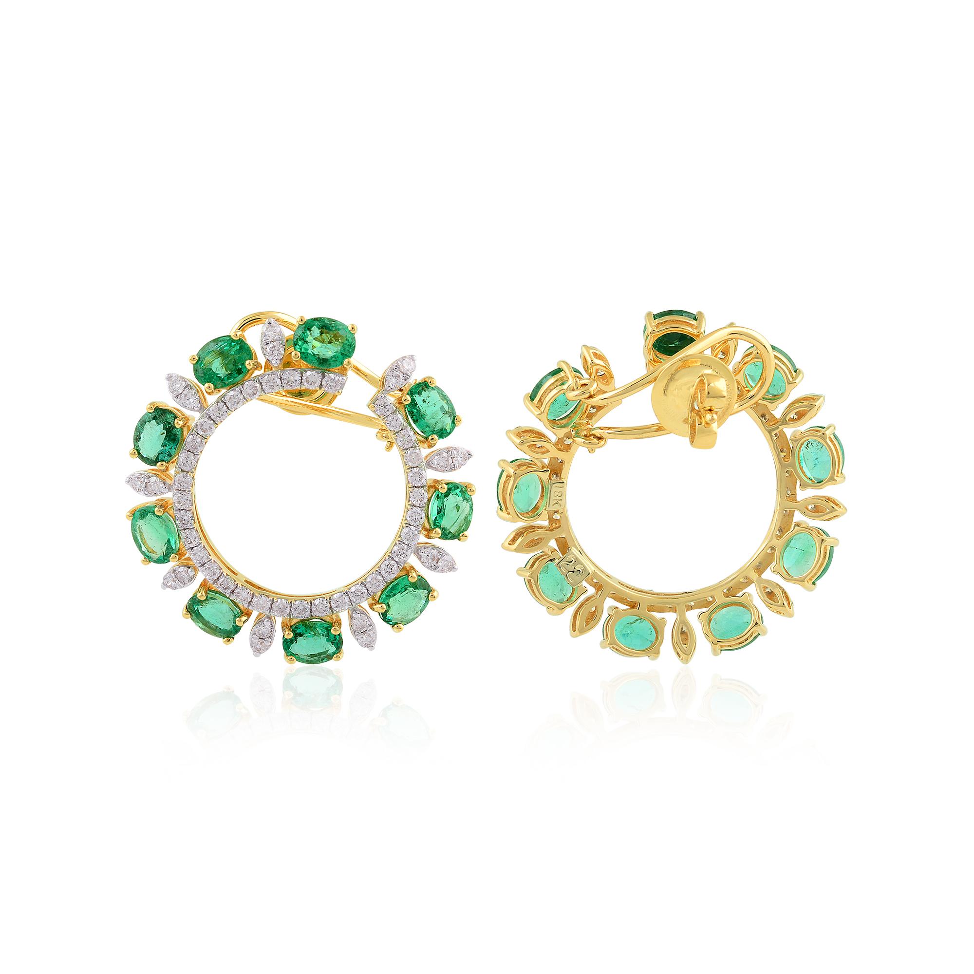 Set in a lustrous 18 karat yellow gold setting, these earrings exude luxury and refinement at every glance. The warm tones of the gold perfectly complement the vivid green of the emeralds, creating a harmonious contrast that enhances the beauty of