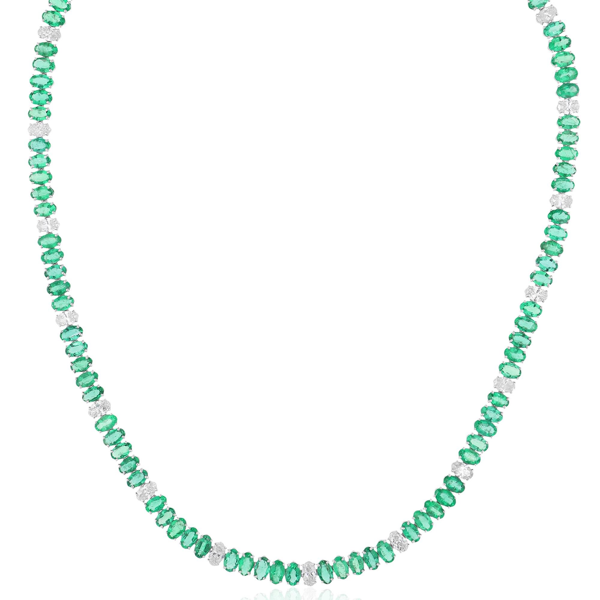 Introducing a stunning masterpiece of fine jewelry, behold this Oval Zambian Emerald Gemstone Necklace adorned with dazzling diamonds and expertly crafted in luxurious 10 karat white gold. Radiating with opulence and sophistication, this exquisite