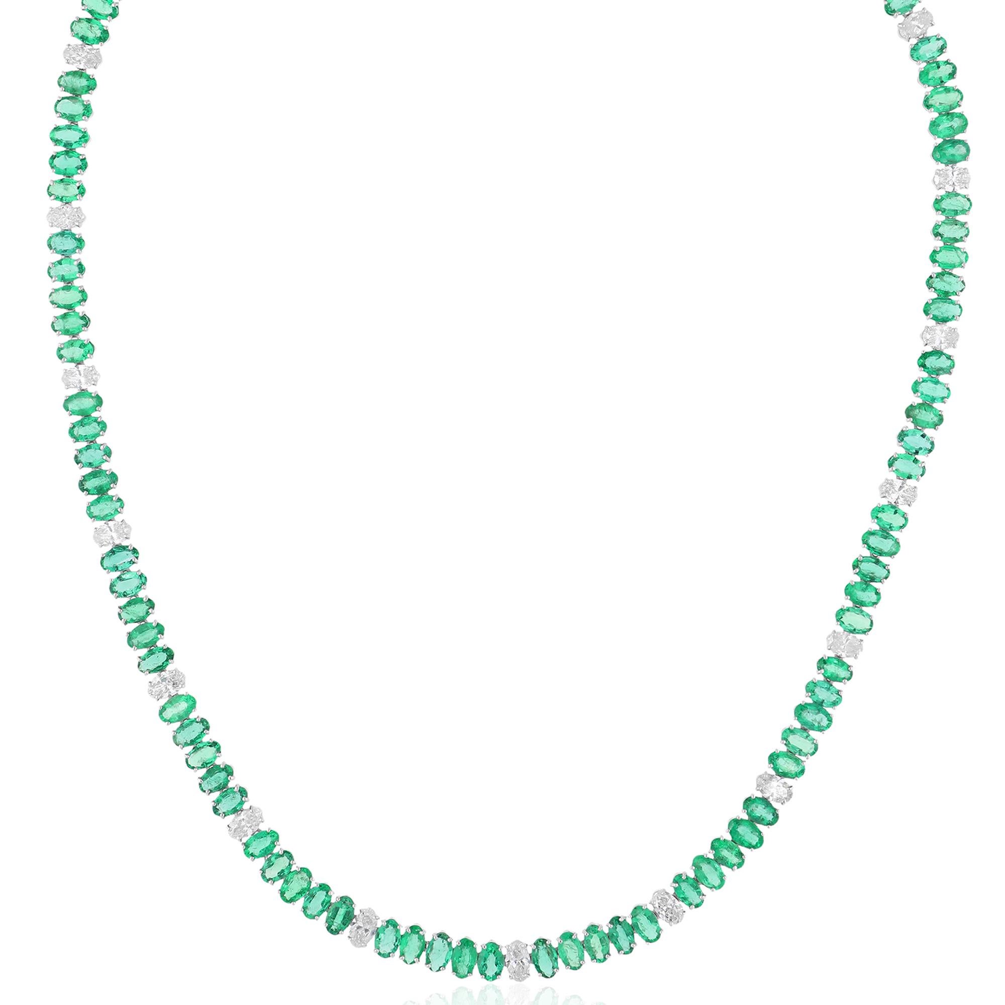 Introducing a stunning masterpiece of fine jewelry, behold this Oval Zambian Emerald Gemstone Necklace adorned with dazzling diamonds and expertly crafted in luxurious 14 karat white gold. Radiating with opulence and sophistication, this exquisite