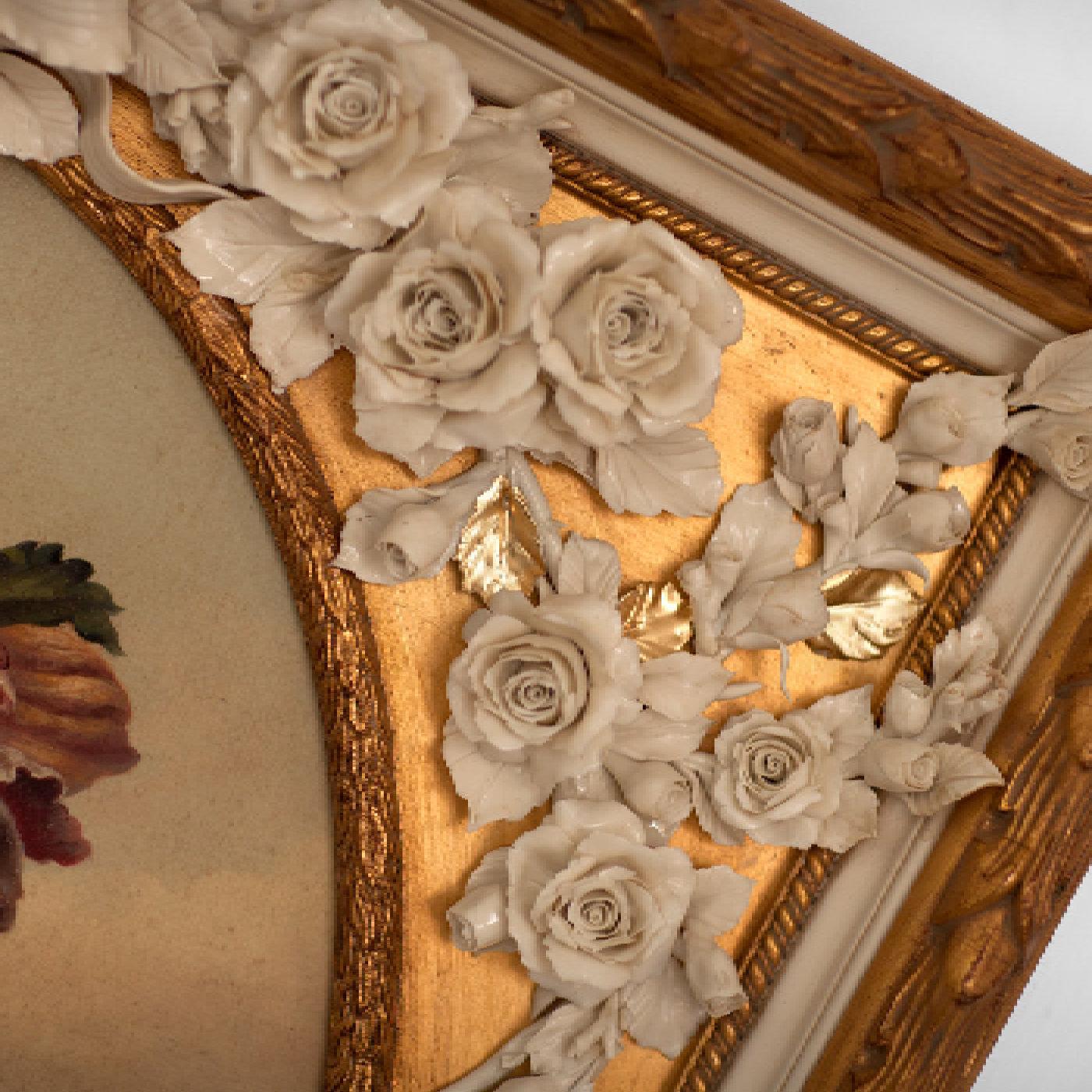A captivating showcase of deft Italian porcelain and wood engraving tradition, this magnificent frame will effortlessly adorn any classic or modern interior alike. Handcrafted of wood enhanced with a burnished gold finish, it is uniquely enriched