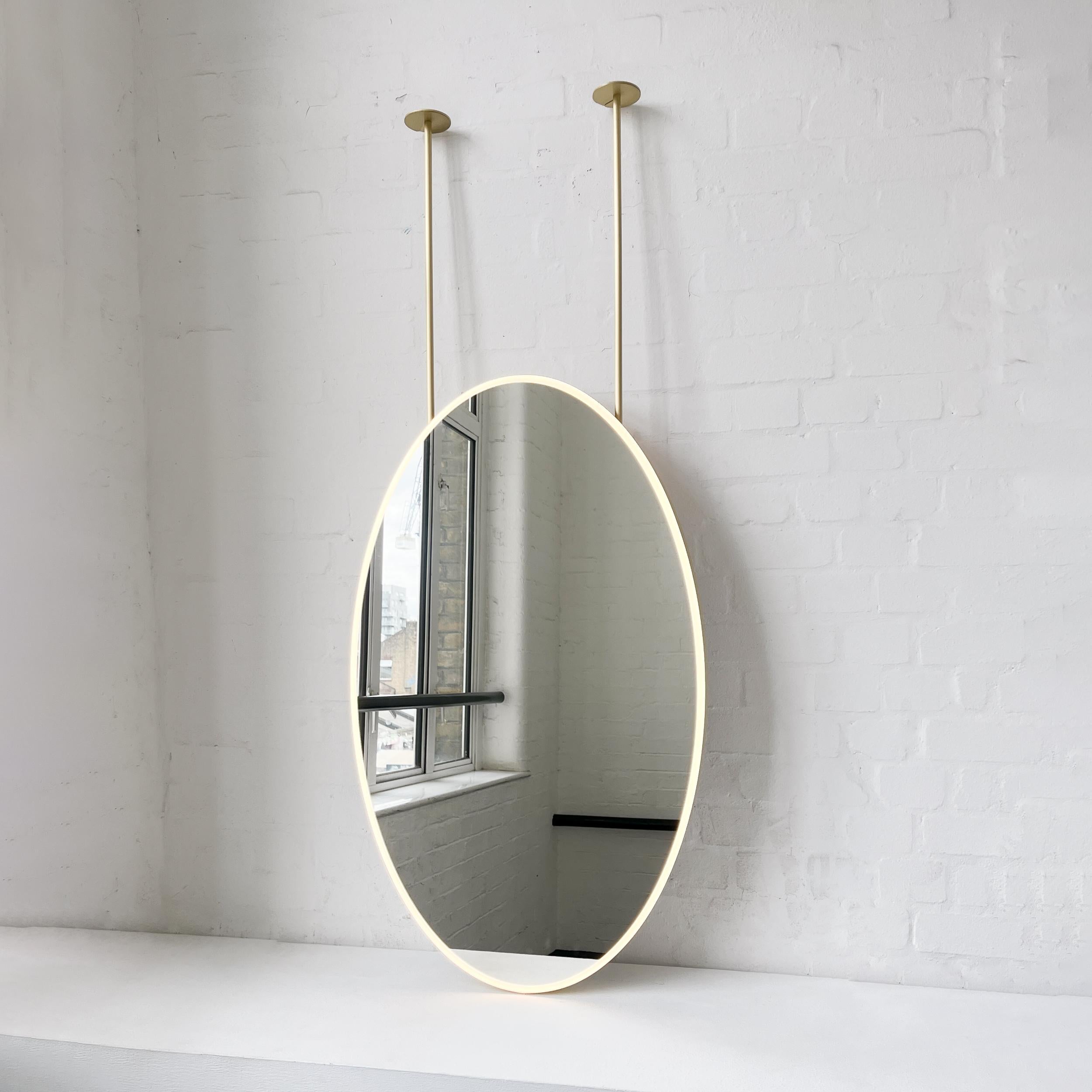 British Ovalis Ceiling Suspended Illuminated Oval Mirror with Brass Frame For Sale