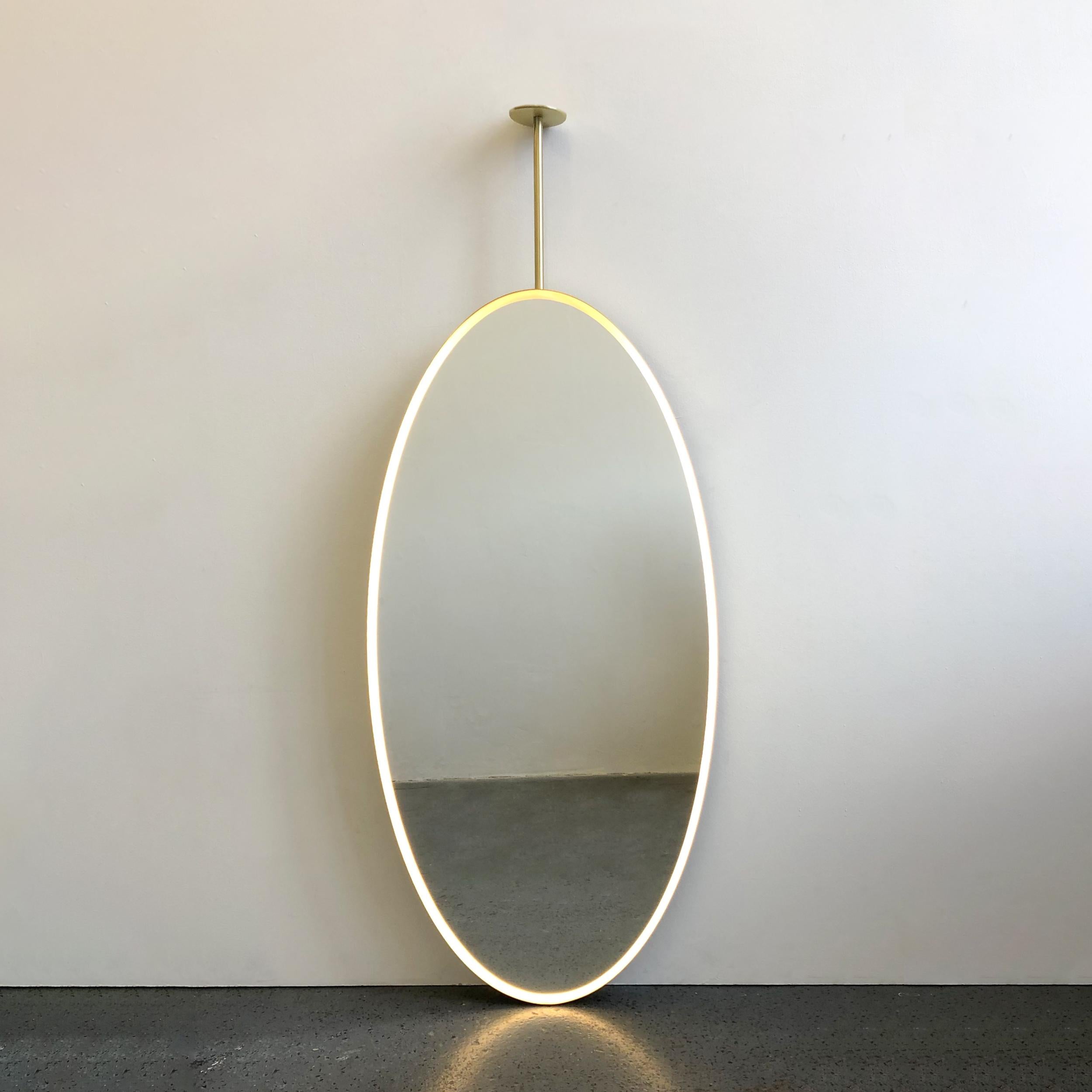 suspended mirror in front of window