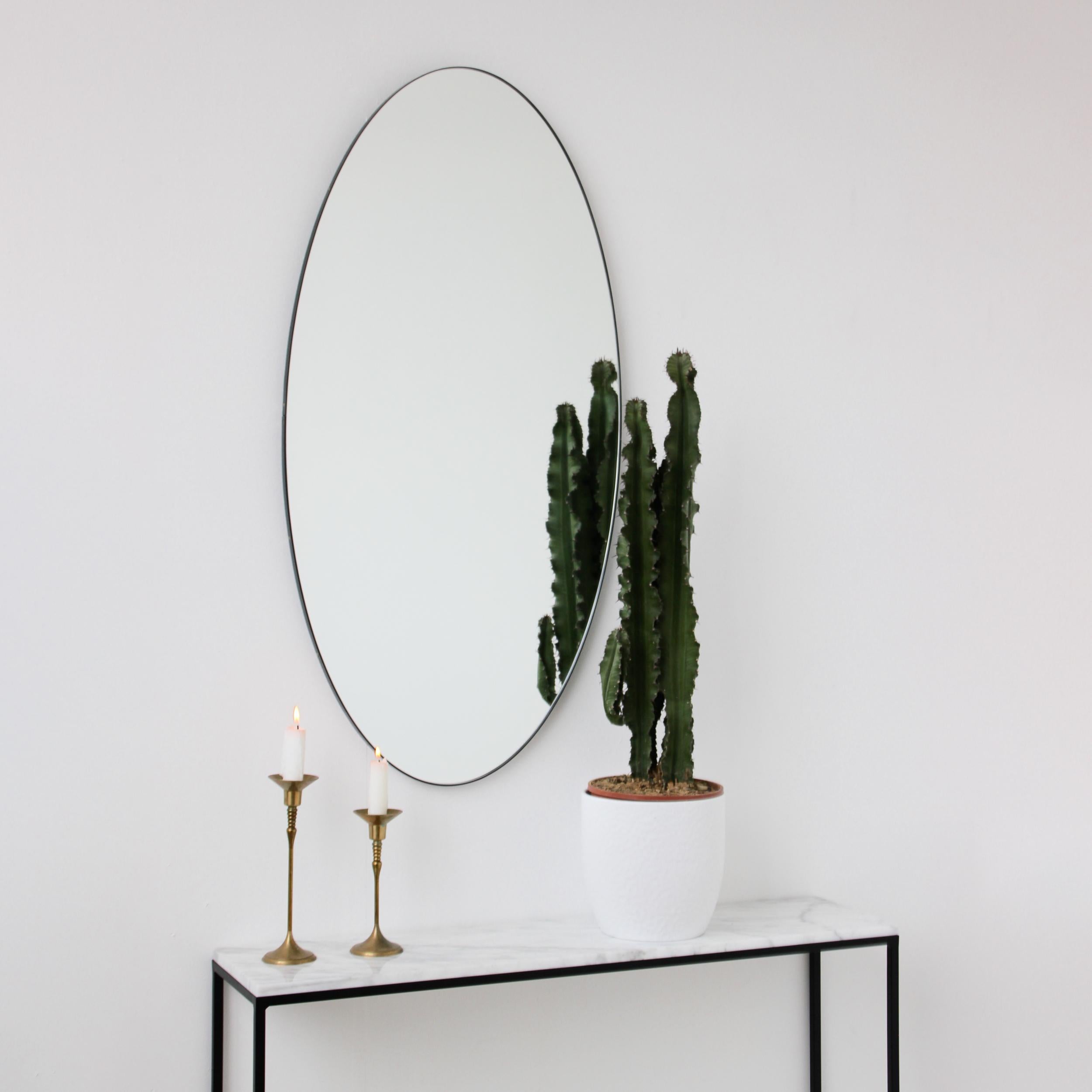 specchio ovale cornice nera